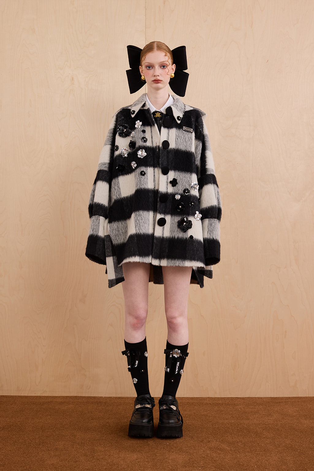 Model wearing merino wool reversible hoodie jacket with cat ears and bows