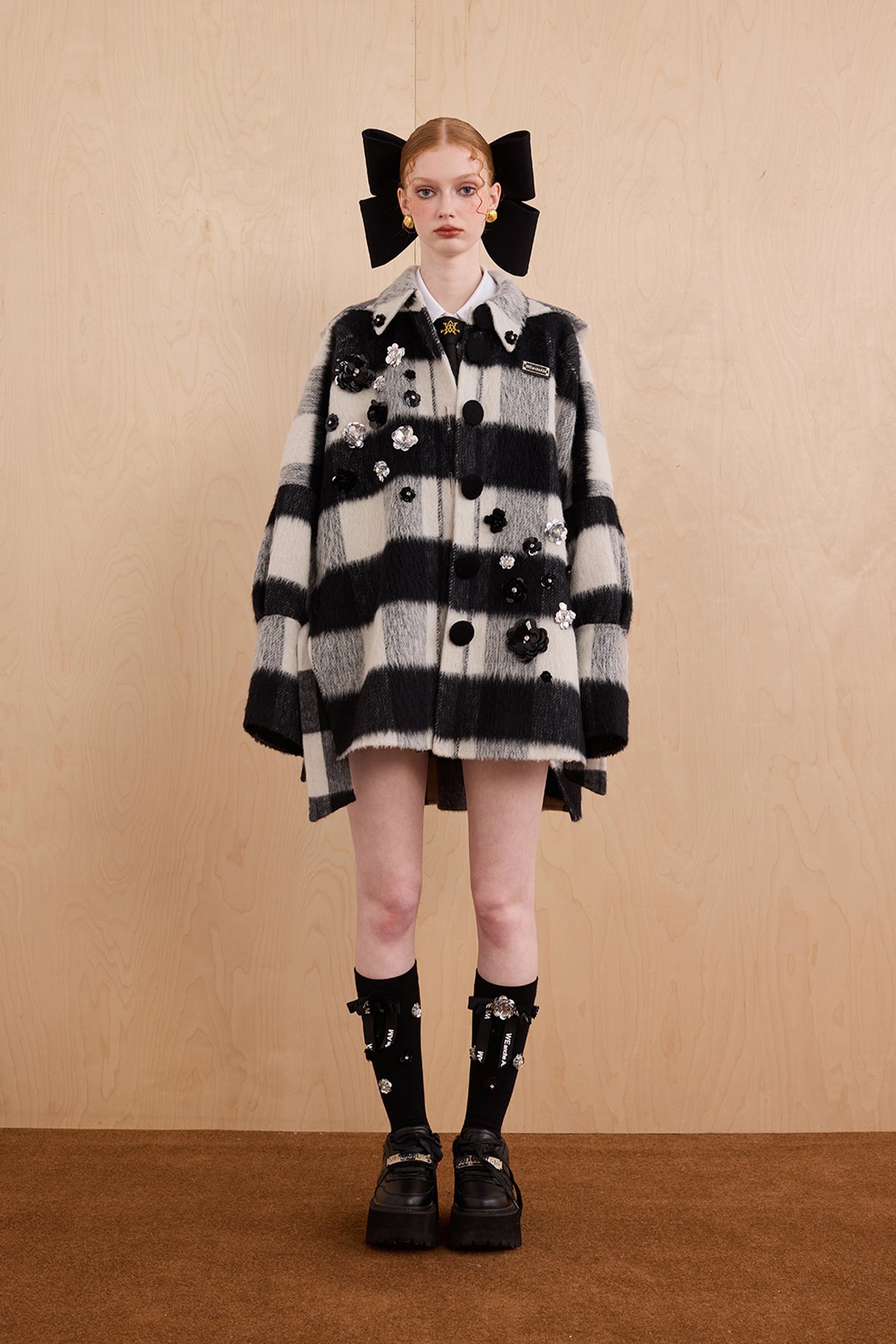 Model wearing merino wool reversible hoodie jacket with cat ears and bows