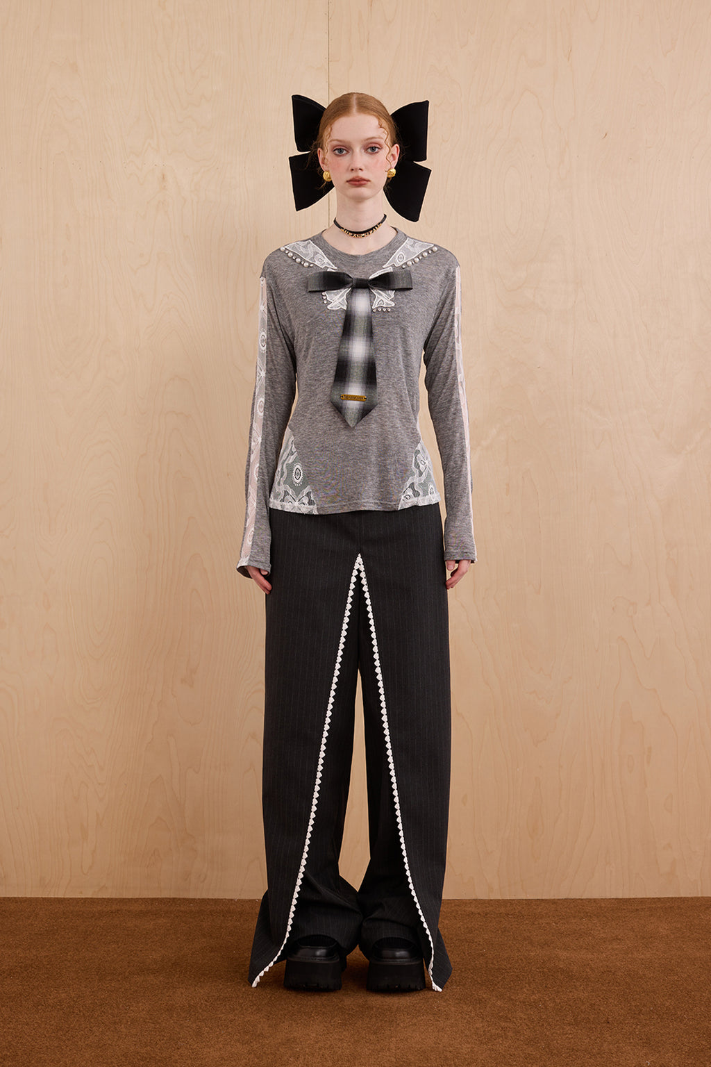 Model wearing slim-fit tie-neck wool blend top with lace accents – WEANCHEAM