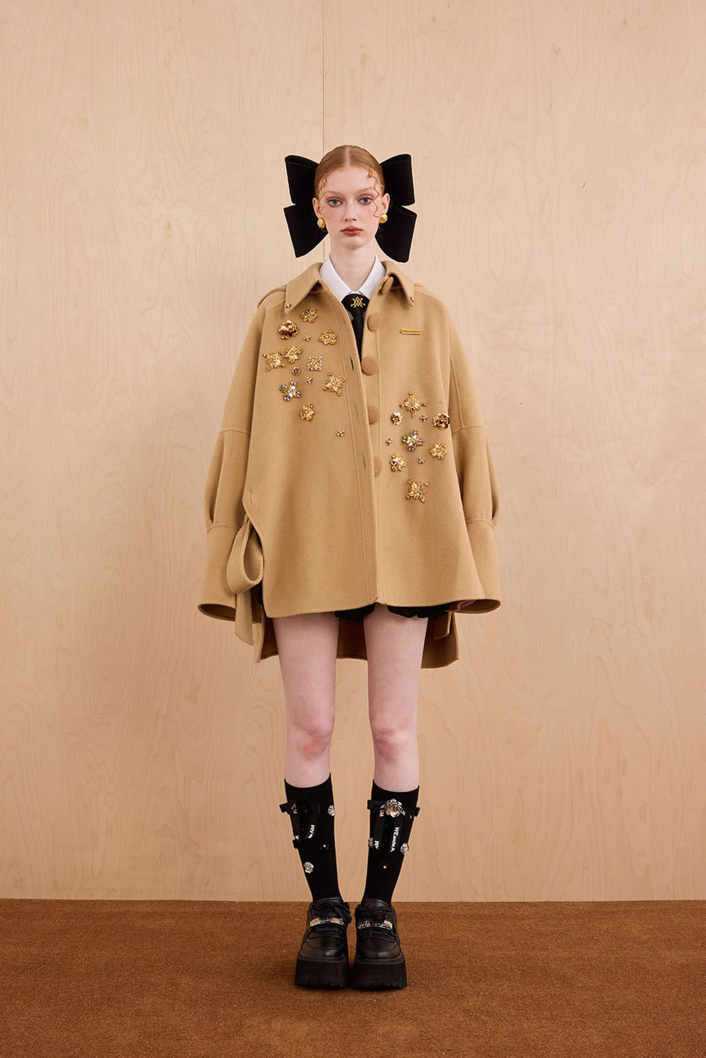 Model wearing merino wool reversible hoodie jacket with cat ears and bows
