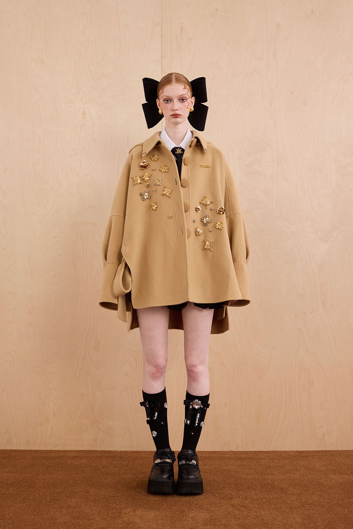 Model wearing merino wool reversible hoodie jacket with cat ears and bows