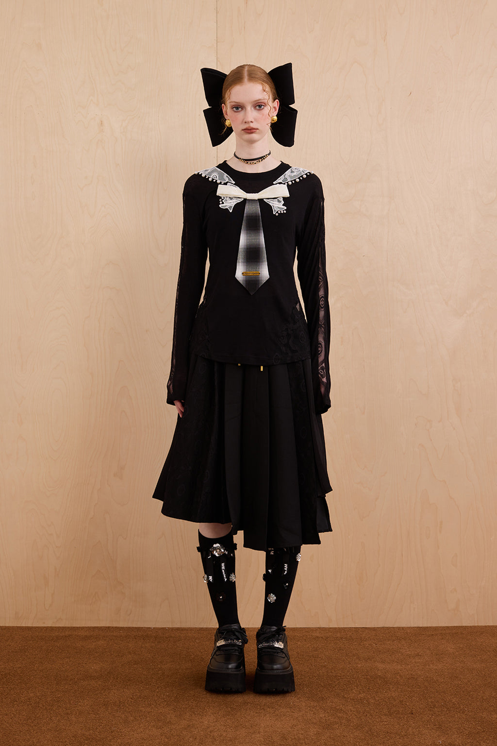Model wearing slim-fit tie-neck wool blend top with lace accents – WEANCHEAM