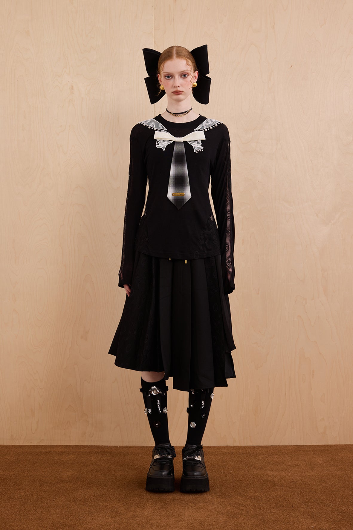Model wearing slim-fit tie-neck wool blend top with lace accents – WEANCHEAM