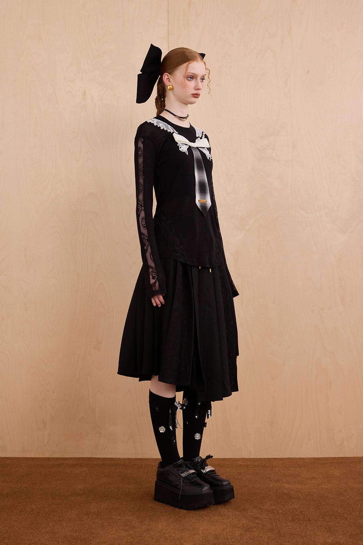 Model wearing slim-fit tie-neck wool blend top with lace accents – WEANCHEAM