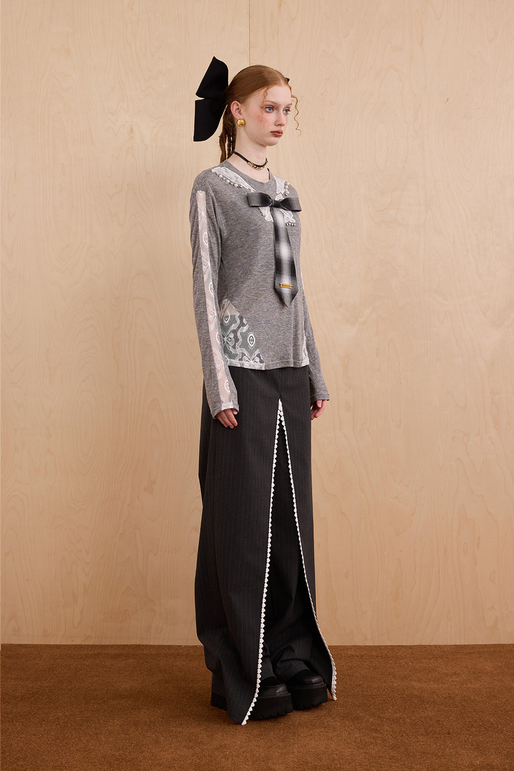 Model wearing slim-fit tie-neck wool blend top with lace accents – WEANCHEAM