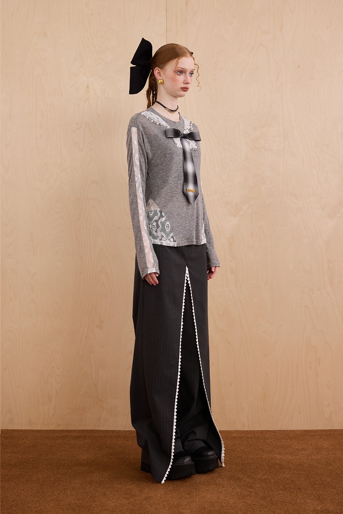 Model wearing slim-fit tie-neck wool blend top with lace accents – WEANCHEAM
