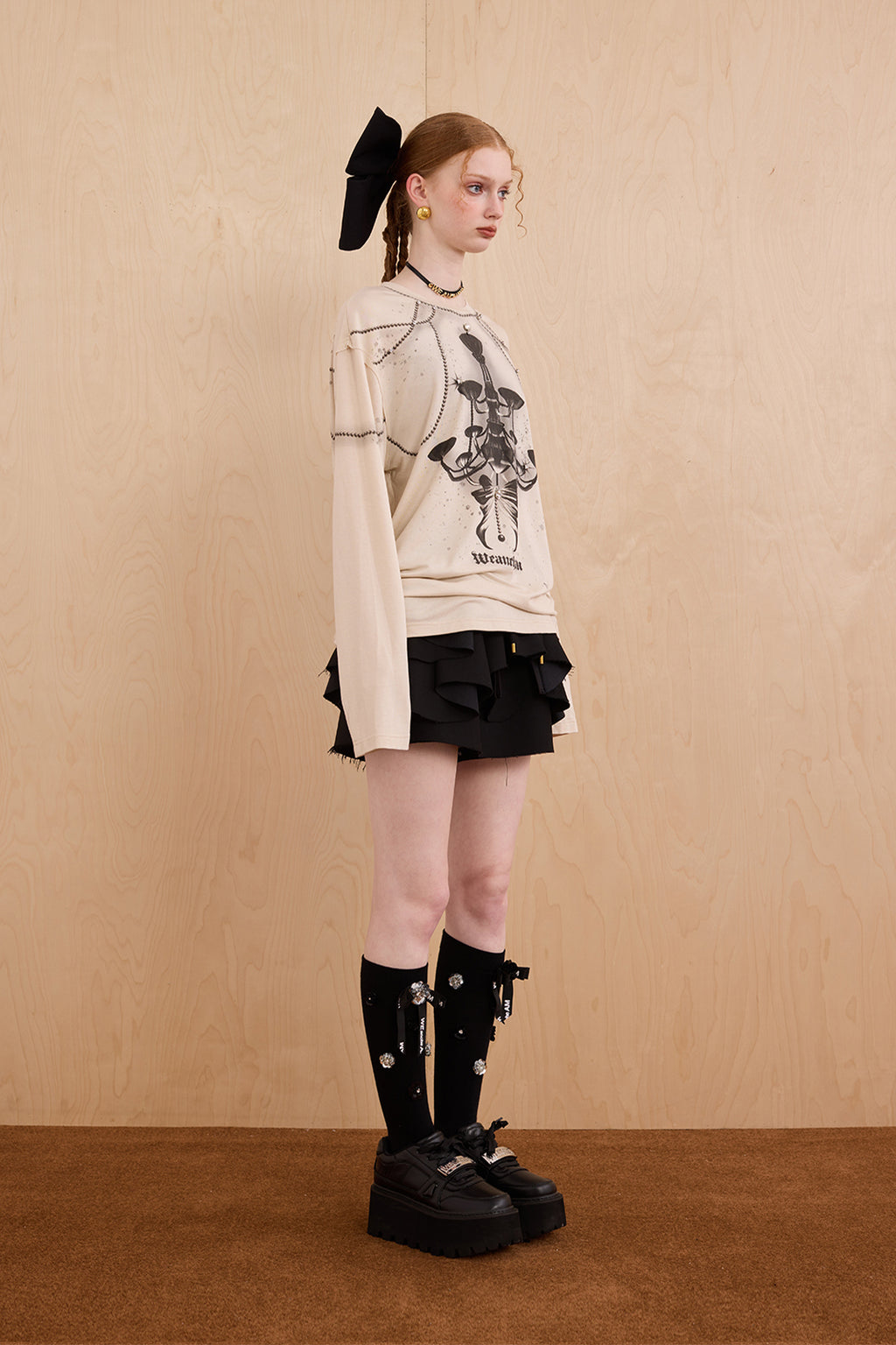 Model in wool-cashmere sweater with crystal chandelier graphic – WEANCHEAM
