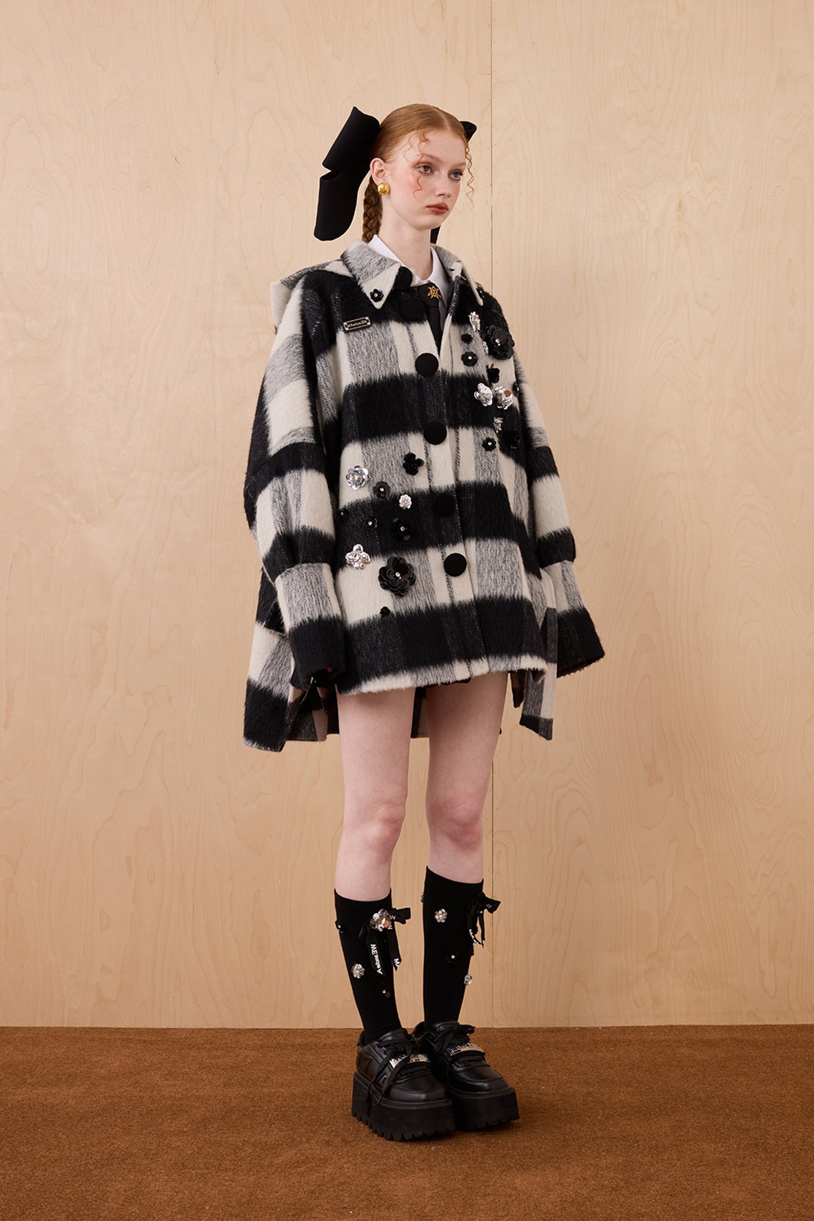 Model wearing merino wool reversible hoodie jacket with cat ears and bows