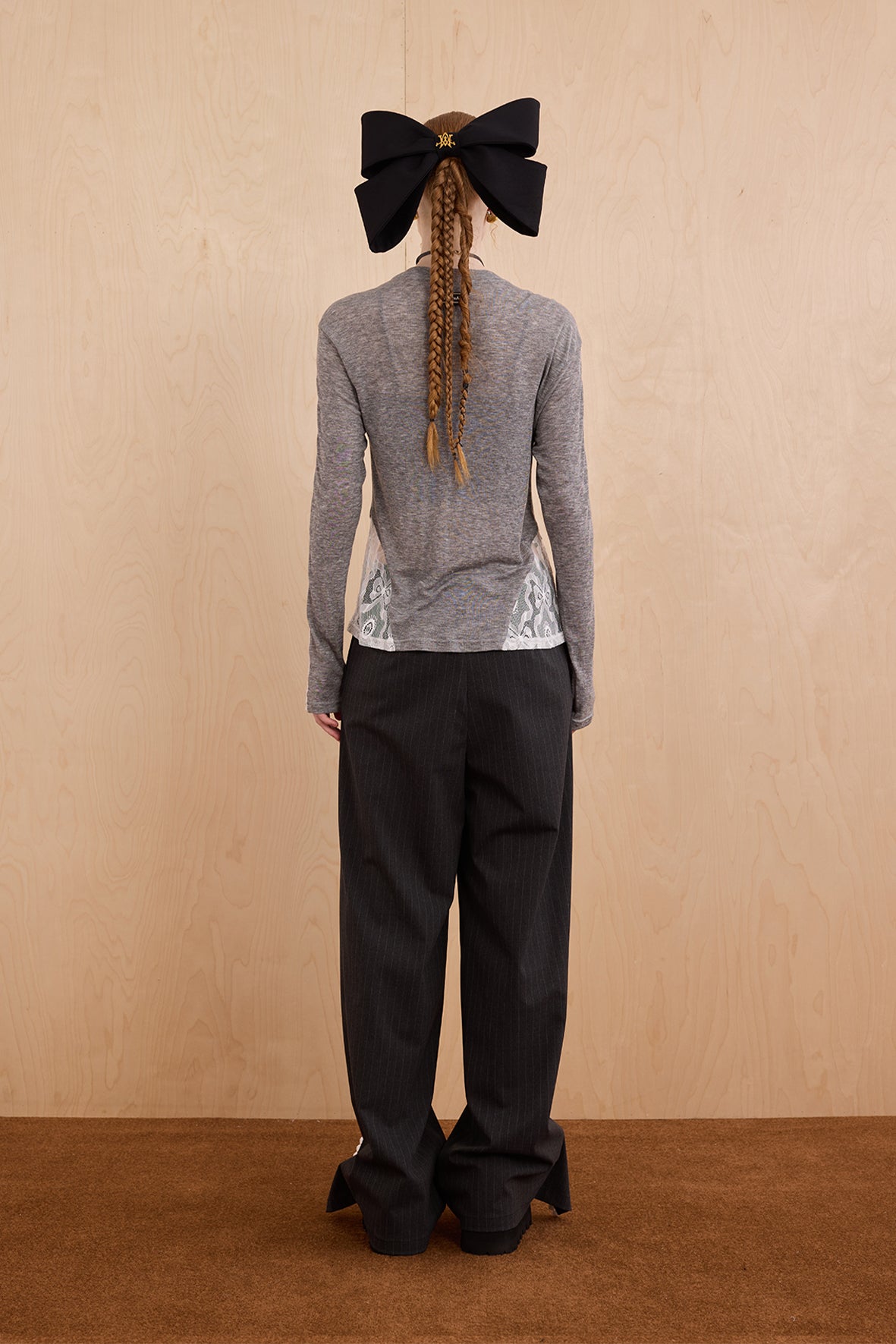 Model wearing slim-fit tie-neck wool blend top with lace accents – WEANCHEAM