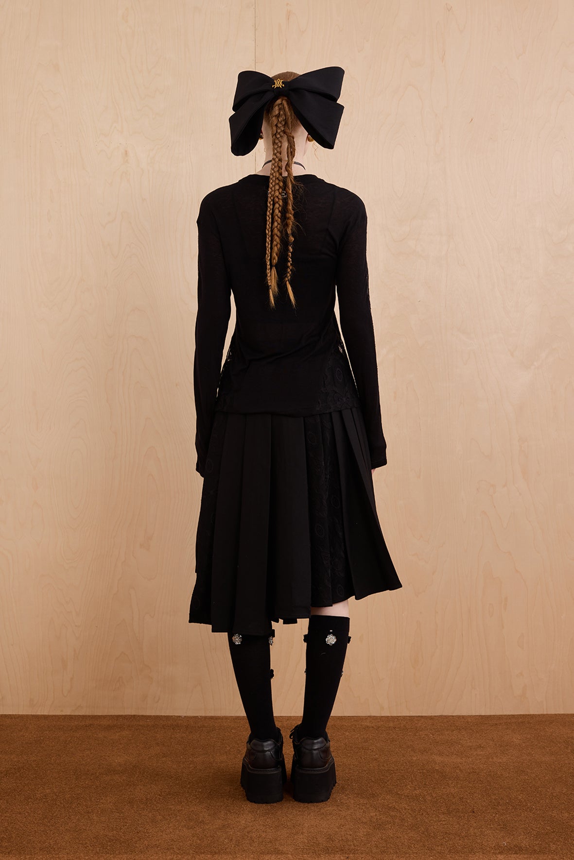 Model wearing slim-fit tie-neck wool blend top with lace accents – WEANCHEAM