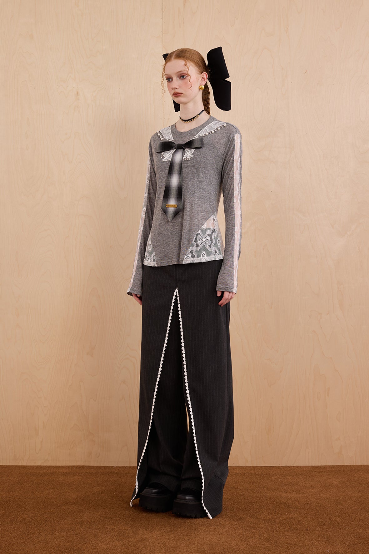 Model wearing slim-fit tie-neck wool blend top with lace accents – WEANCHEAM