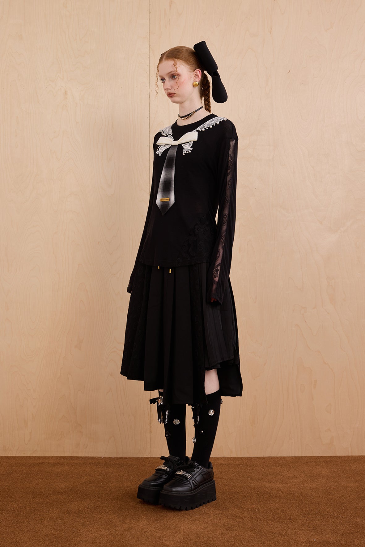 Model wearing slim-fit tie-neck wool blend top with lace accents – WEANCHEAM
