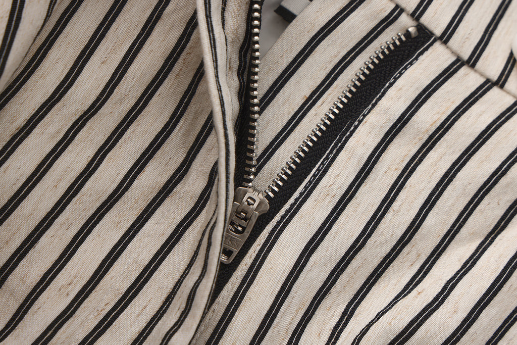 Close-up of jacquard waistband and soft flared hem on flower bud pants
