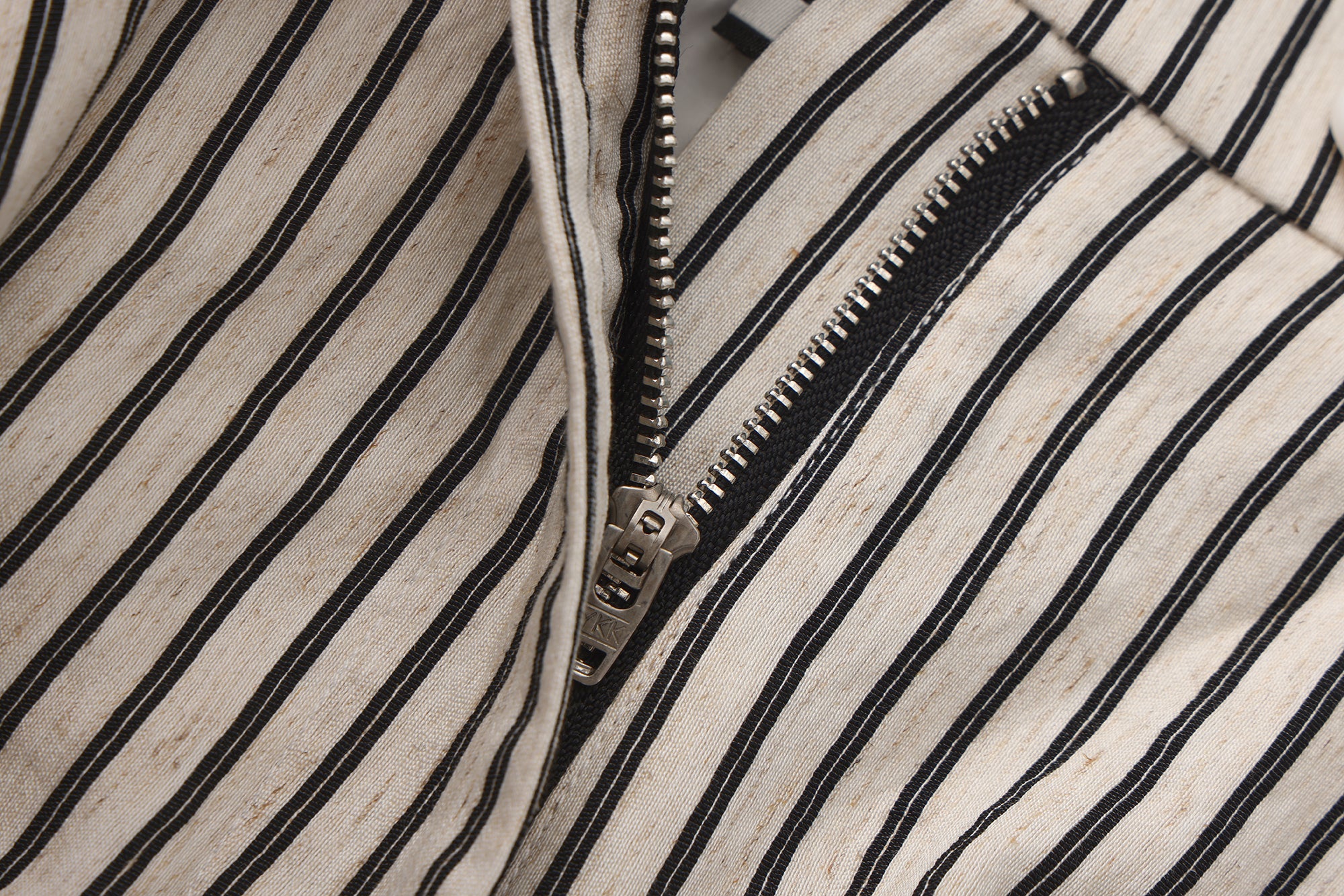 Close-up of jacquard waistband and soft flared hem on flower bud pants