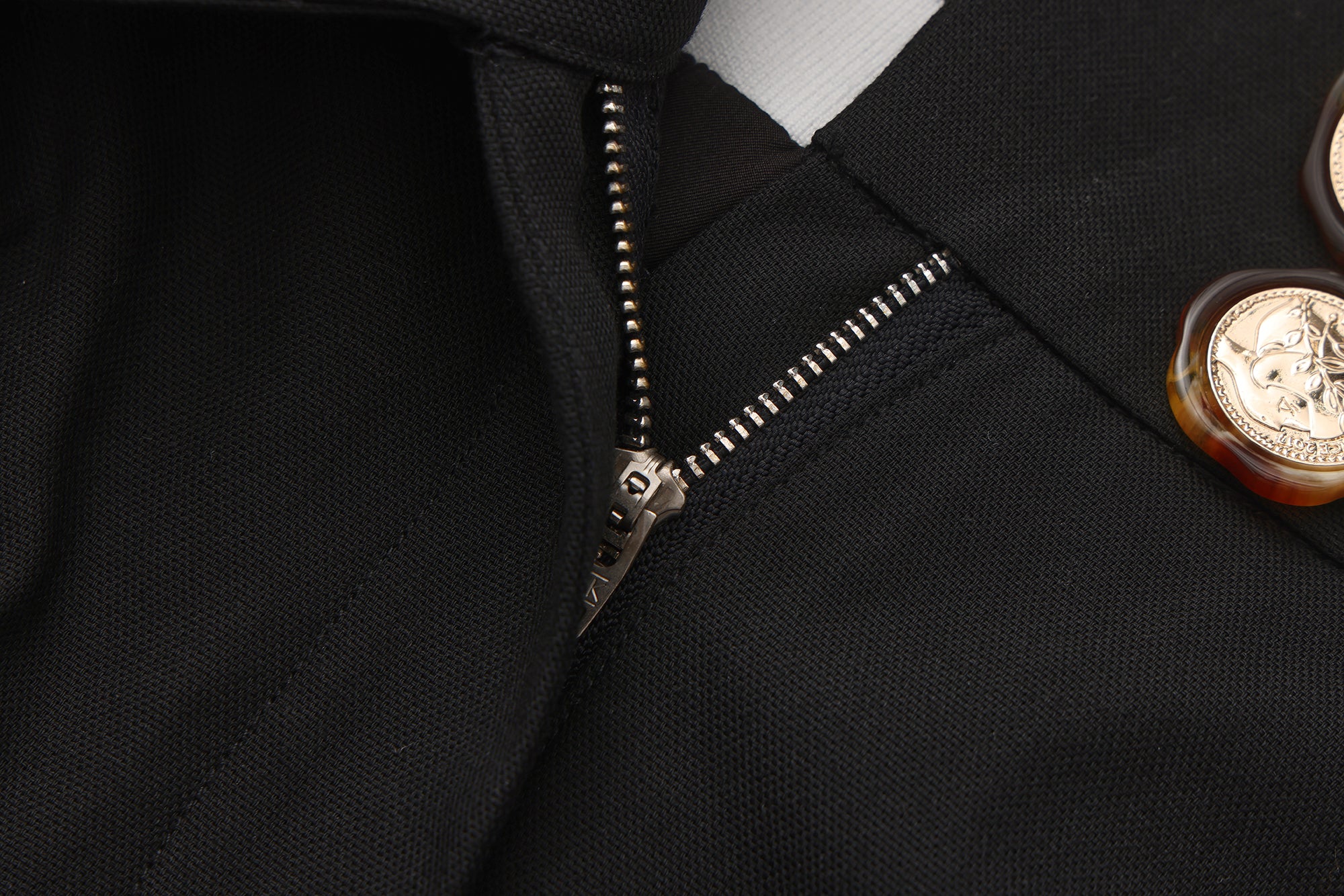 Close-up of jacquard waistband and soft flared hem on flower bud pants