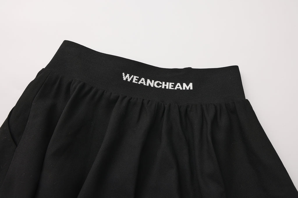 Close-up of jacquard waistband and soft flared hem on flower bud pants