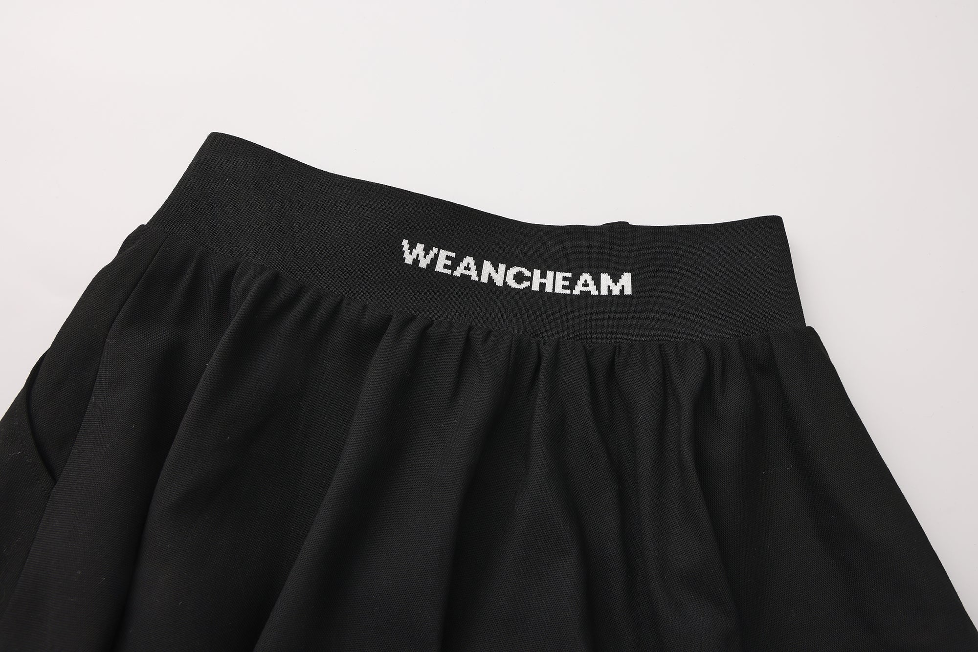 Close-up of jacquard waistband and soft flared hem on flower bud pants