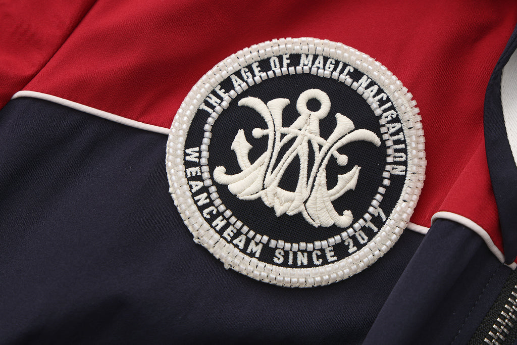 Close-up of striped accents and nylon wrinkle-resistant fabric on navy collar dress