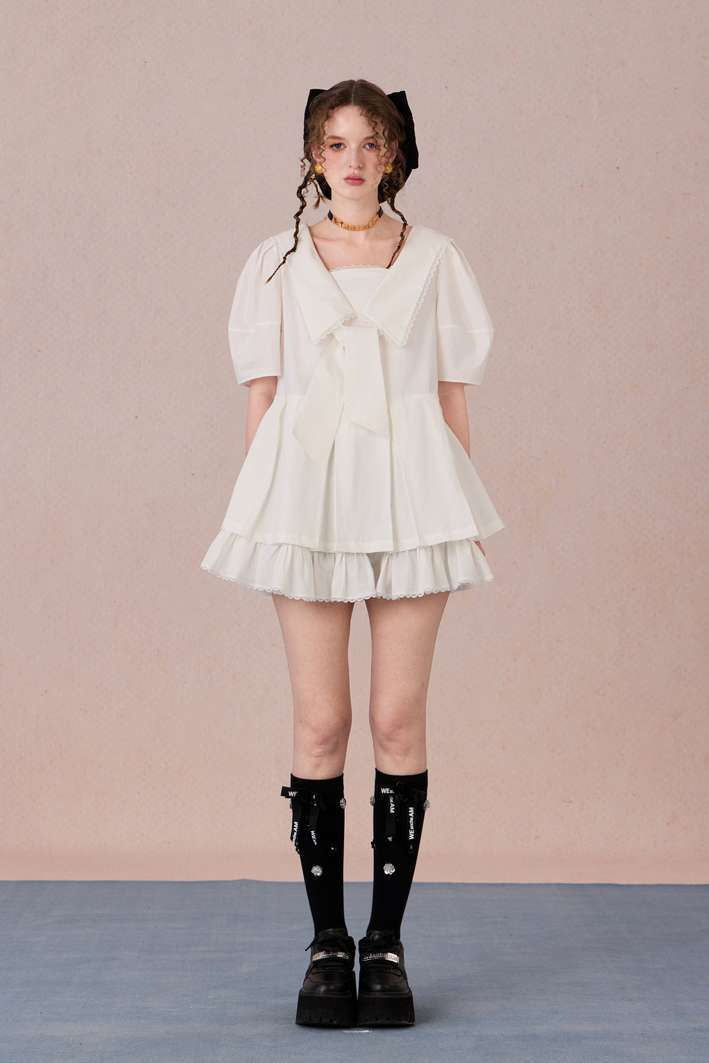   Vintage puff sleeve dress with ruffle hem and tie-neck detail