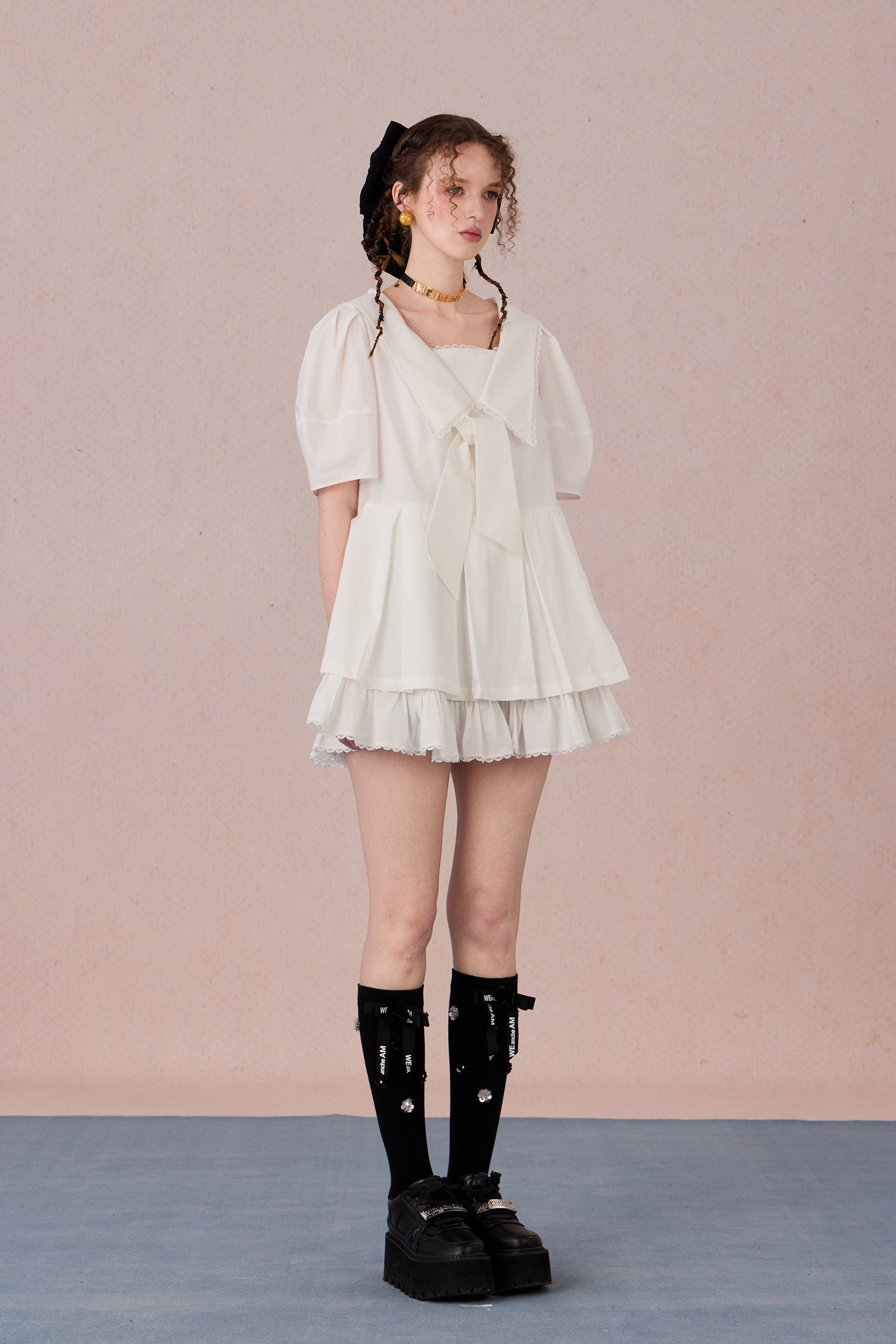  Vintage puff sleeve dress with ruffle hem and tie-neck detail