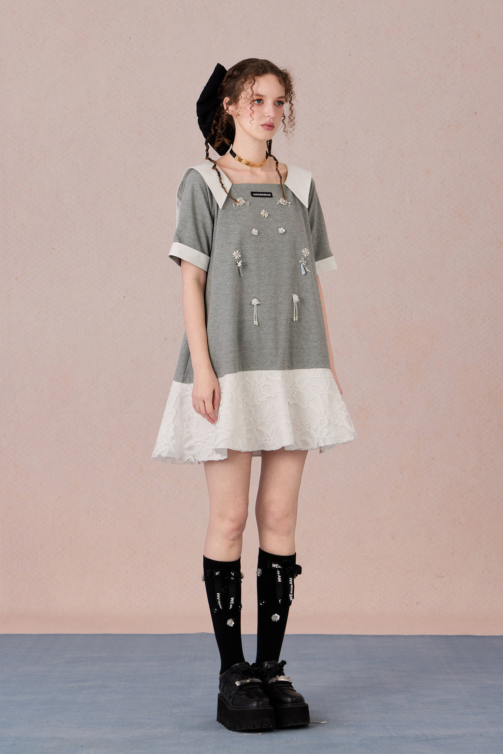 Relaxed fit floral cotton dress with navy border and romantic lace hemline