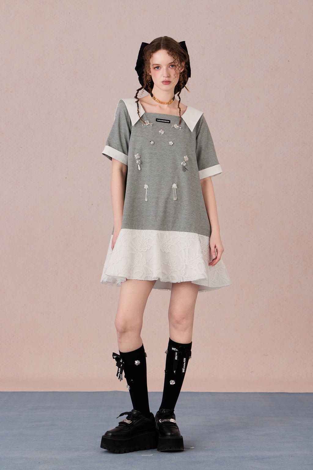 Relaxed fit floral cotton dress with navy border and romantic lace hemline