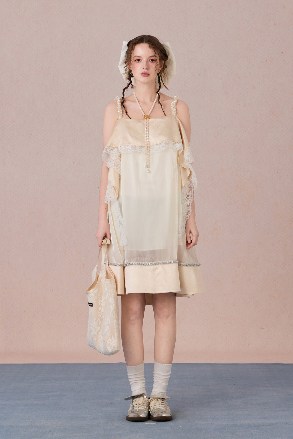 Model in strapless satin mesh dress with pearl halter – WEANCHEAM