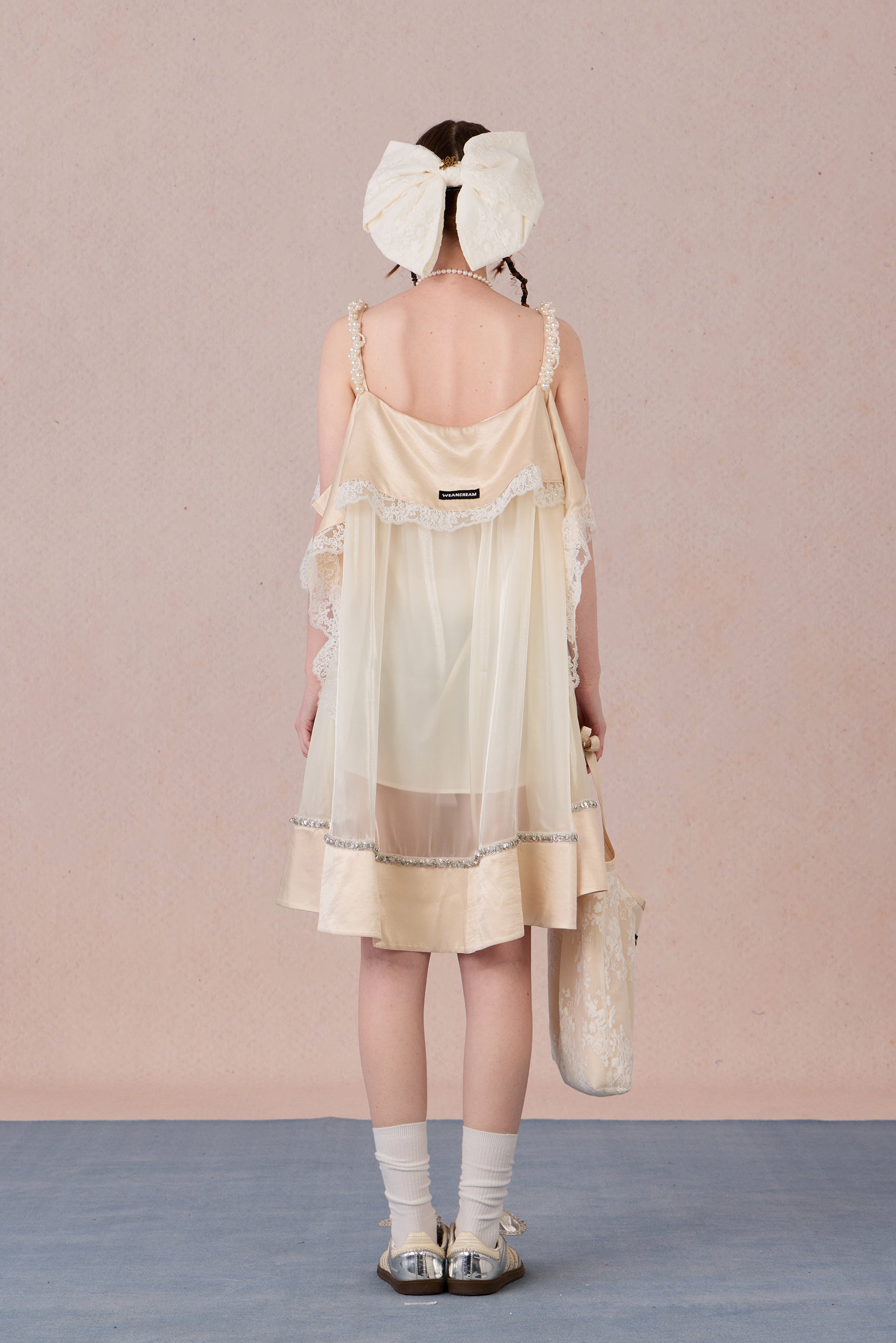 Model in strapless satin mesh dress with pearl halter – WEANCHEAM