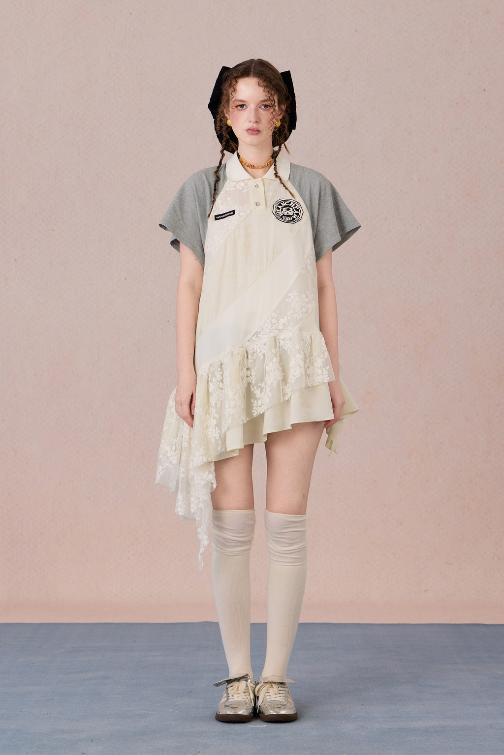 Model wearing loose-fit polo dress with layered spiral hem and embroidery – WEANCHEAM