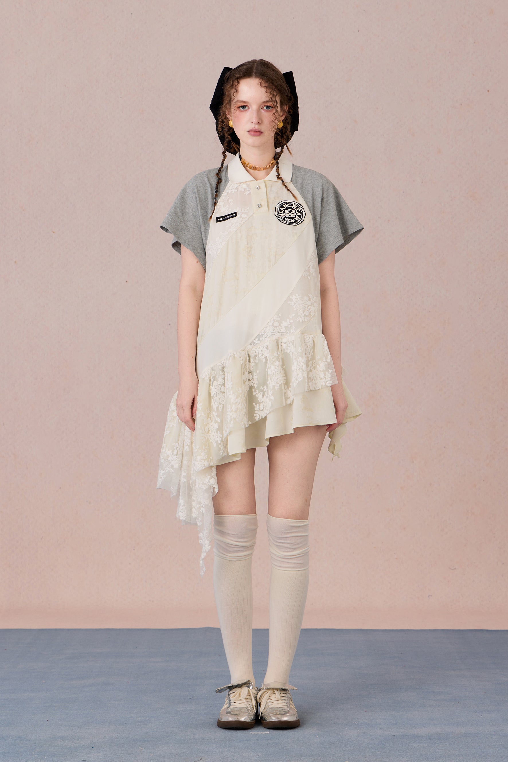 Model wearing loose-fit polo dress with layered spiral hem and embroidery – WEANCHEAM