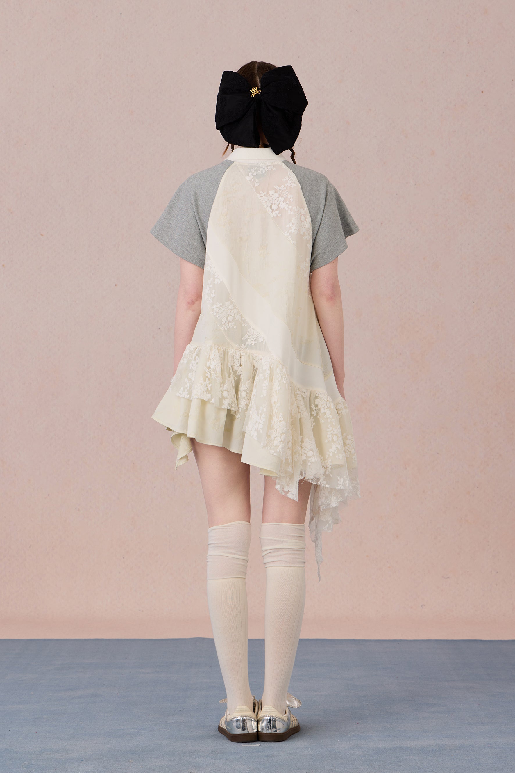 Model wearing loose-fit polo dress with layered spiral hem and embroidery – WEANCHEAM