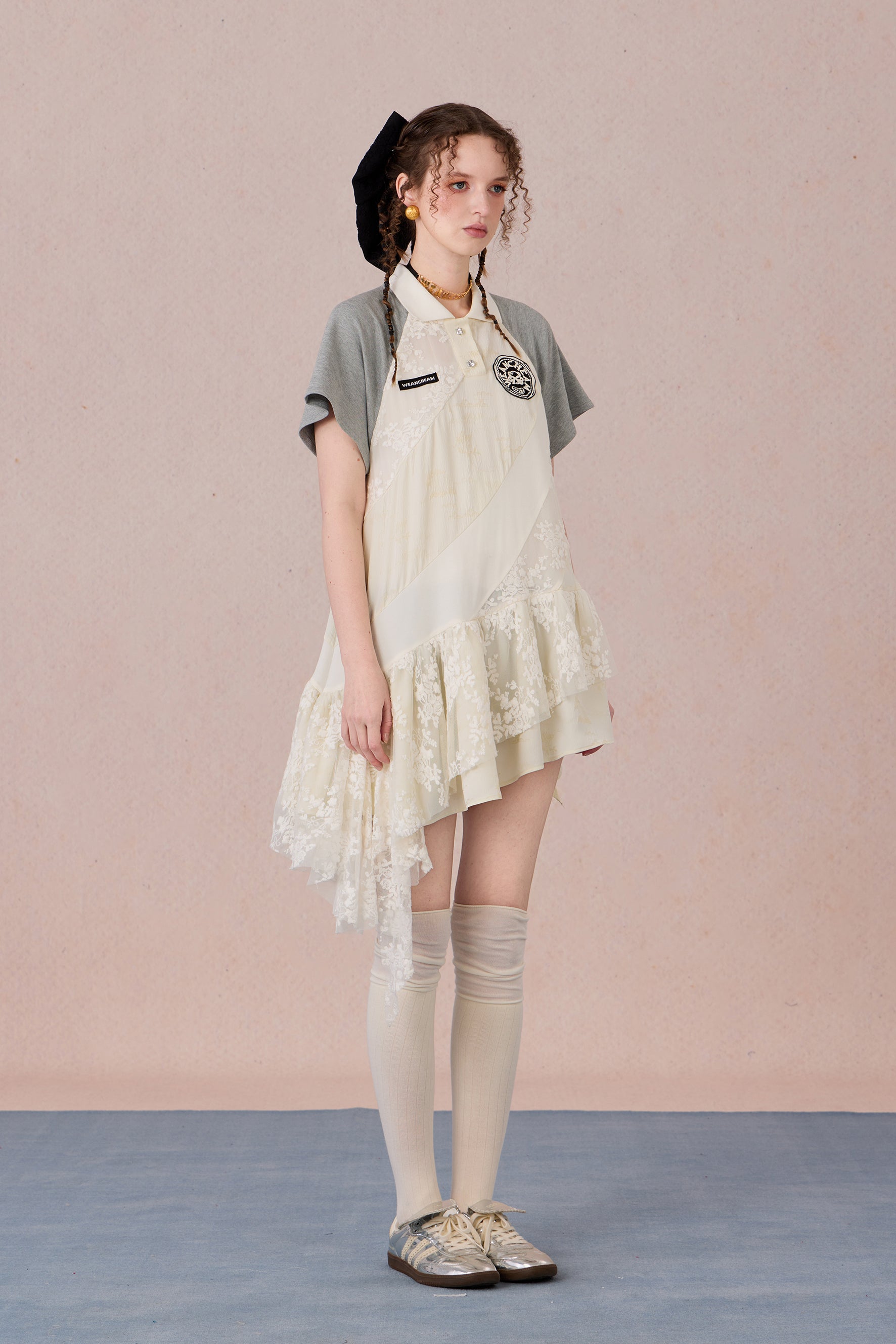 Model wearing loose-fit polo dress with layered spiral hem and embroidery – WEANCHEAM