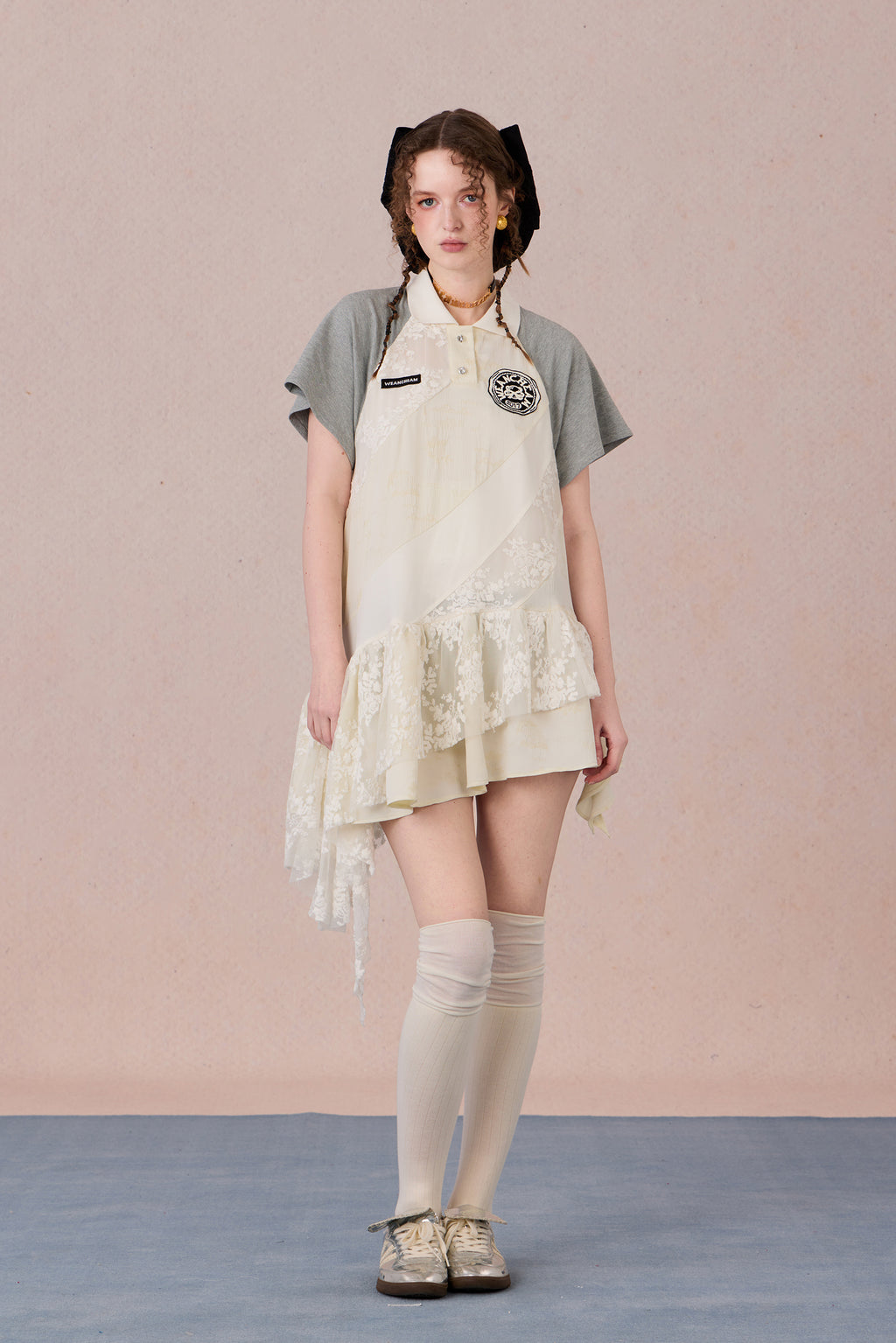 Model wearing loose-fit polo dress with layered spiral hem and embroidery – WEANCHEAM