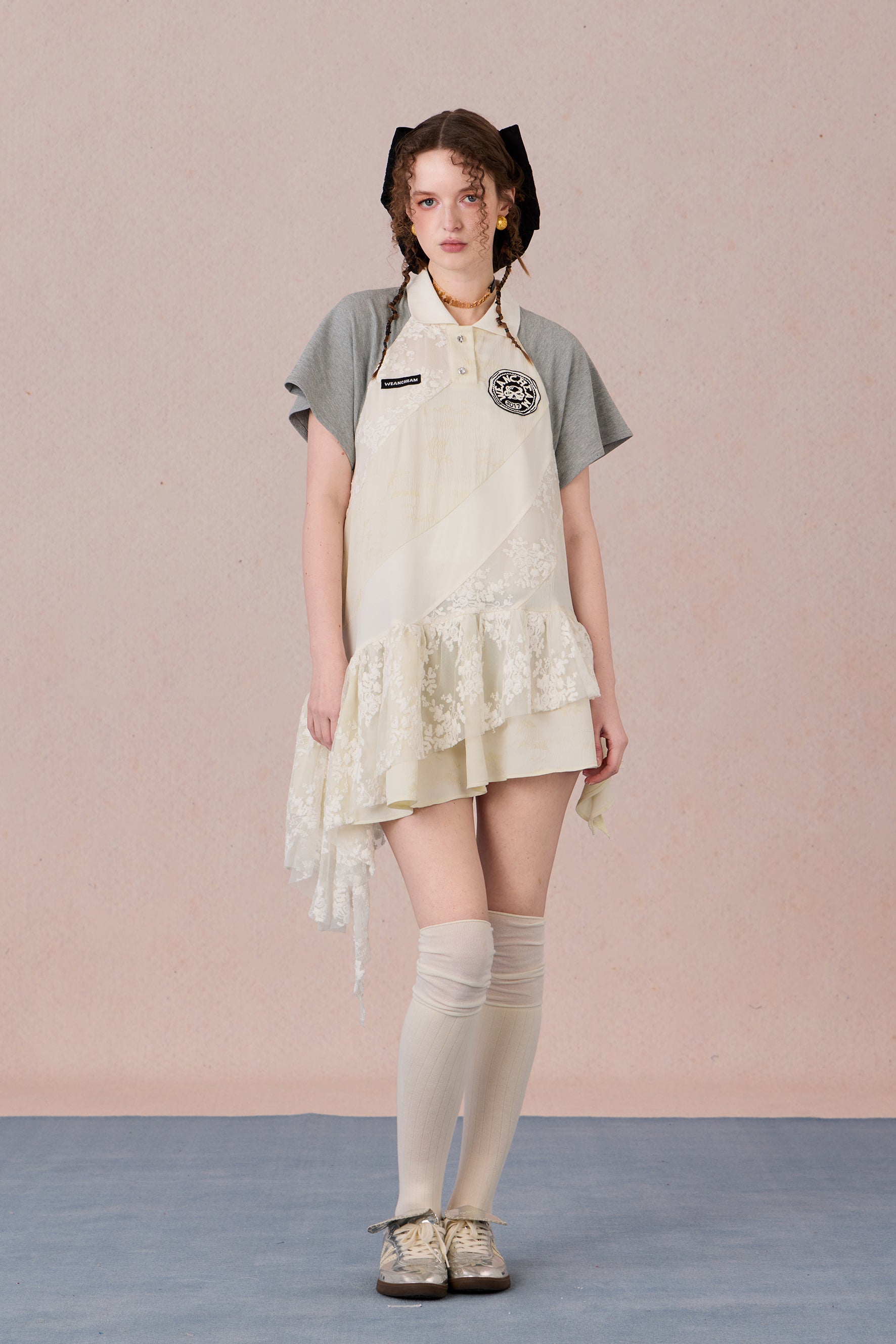 Model wearing loose-fit polo dress with layered spiral hem and embroidery – WEANCHEAM