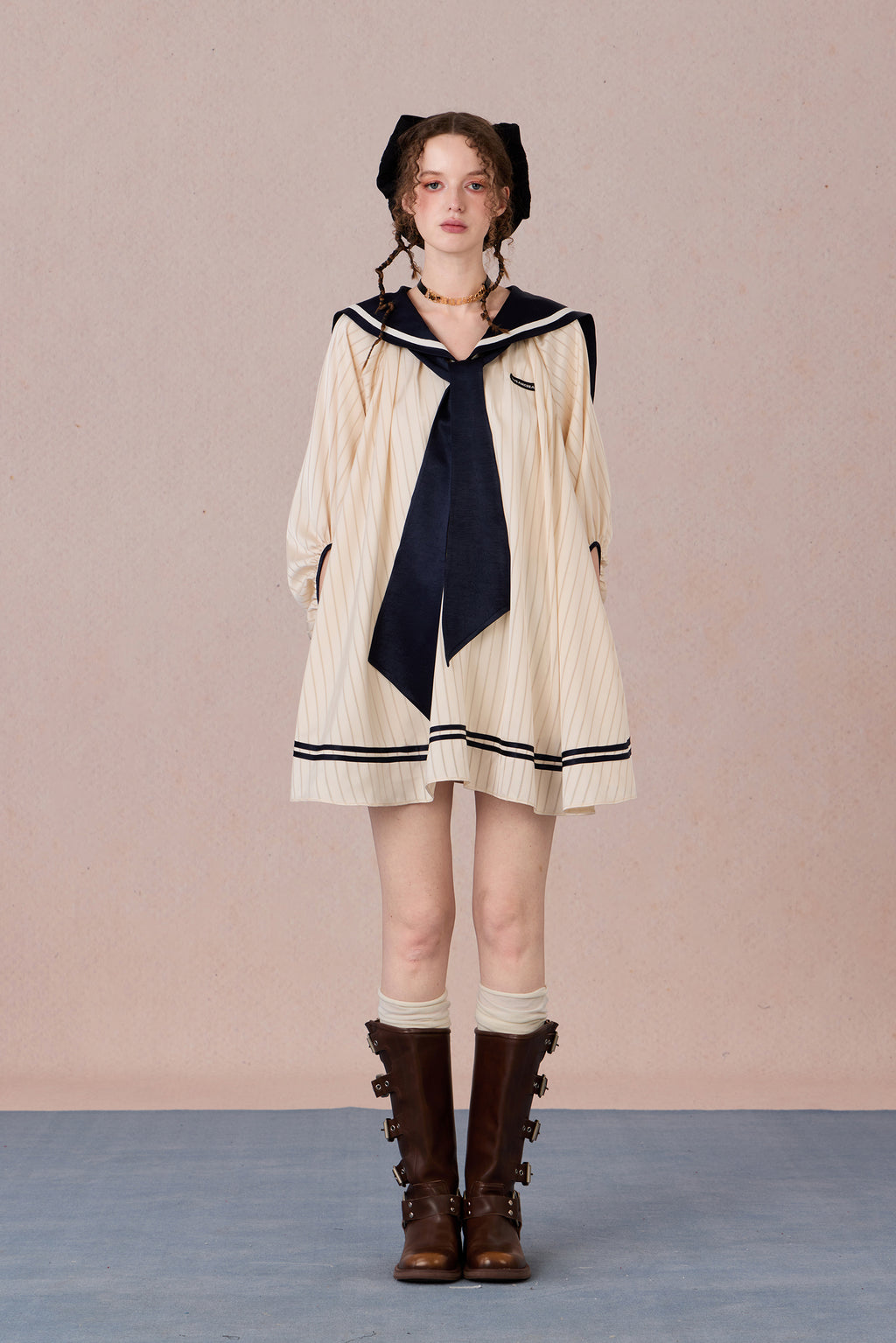Relaxed tie-neck flutter sleeve dress in navy and black trim