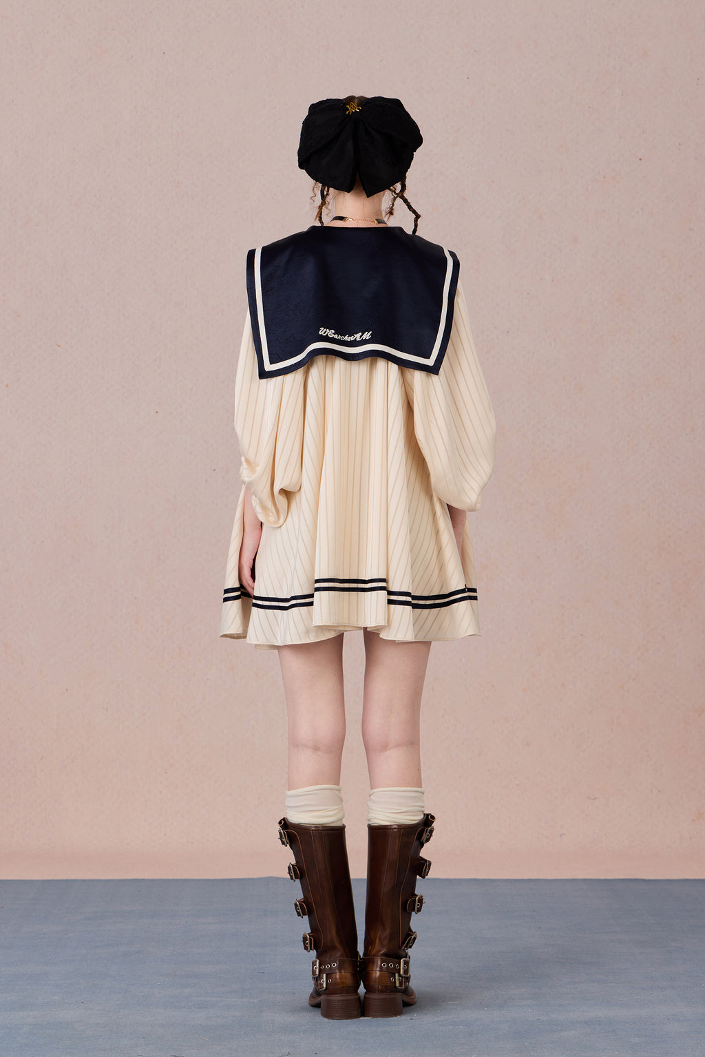Relaxed tie-neck flutter sleeve dress in navy and black trim