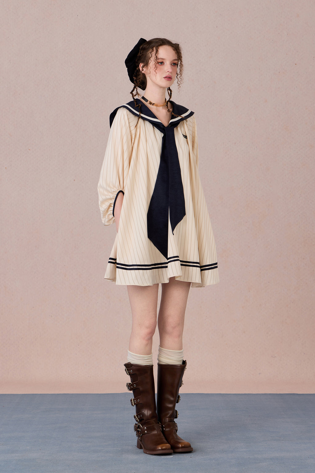 Relaxed tie-neck flutter sleeve dress in navy and black trim