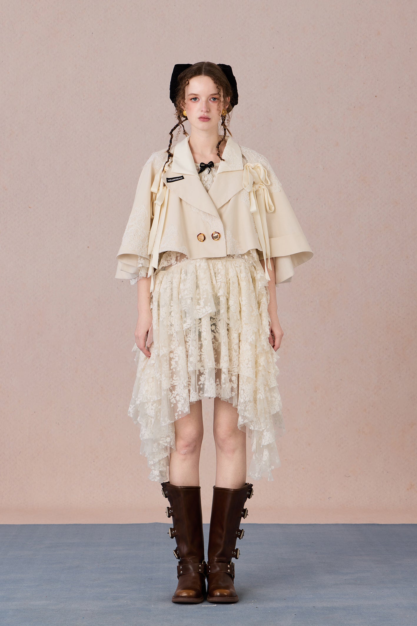 Short suit jacket with romantic lace trim and functional hood