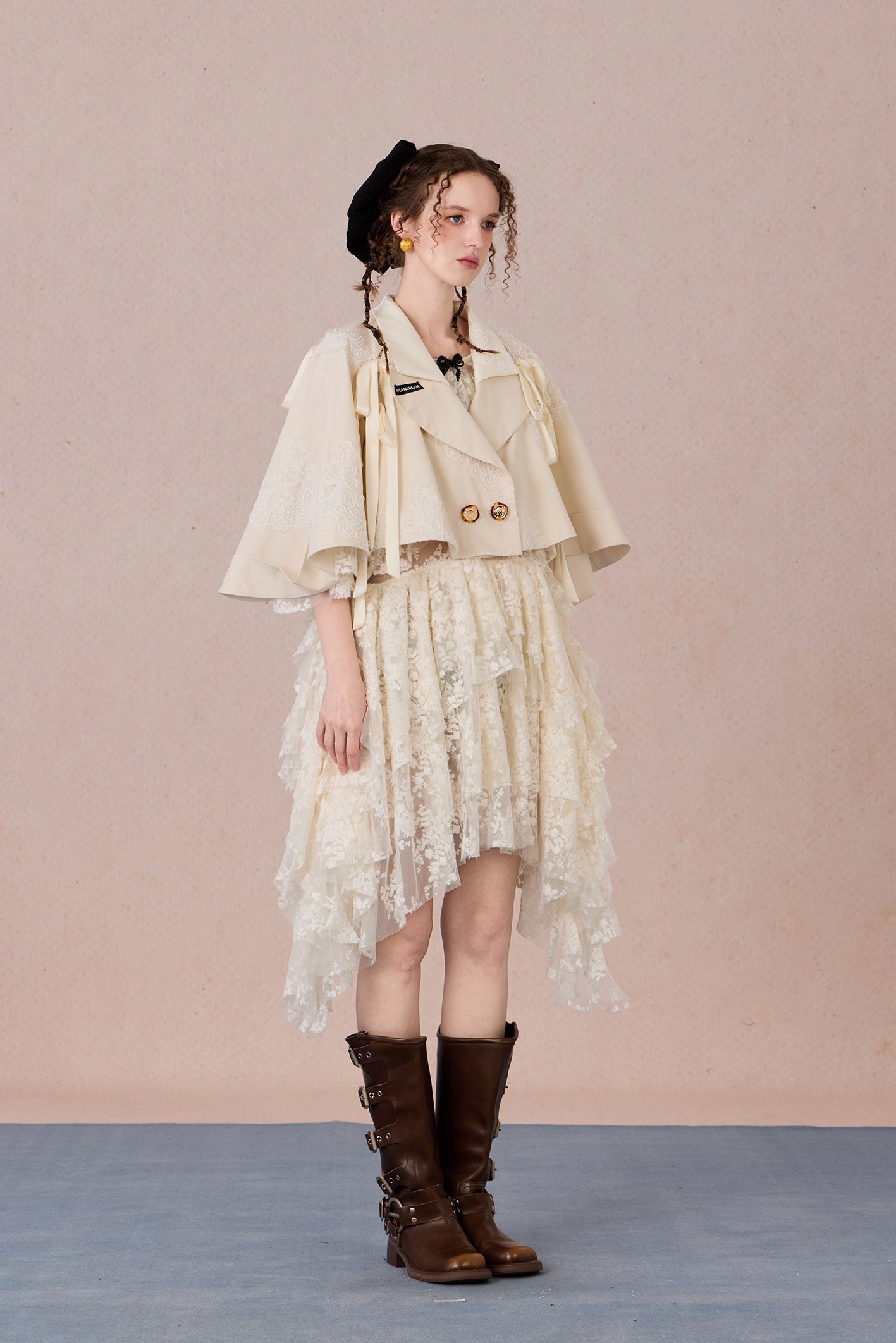 Short suit jacket with romantic lace trim and functional hood