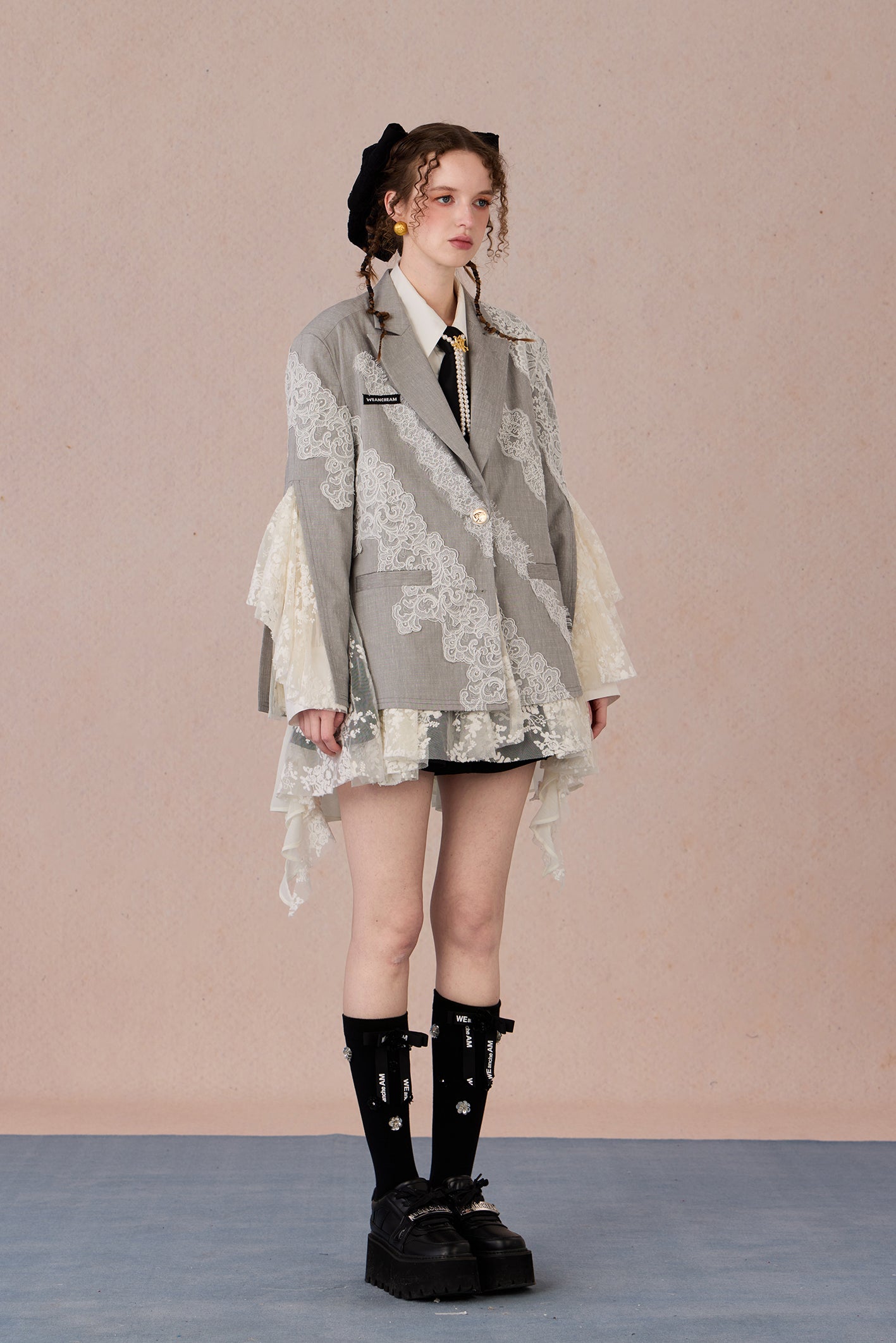 Linen blend tailored jacket with lace applique and irregular hemline