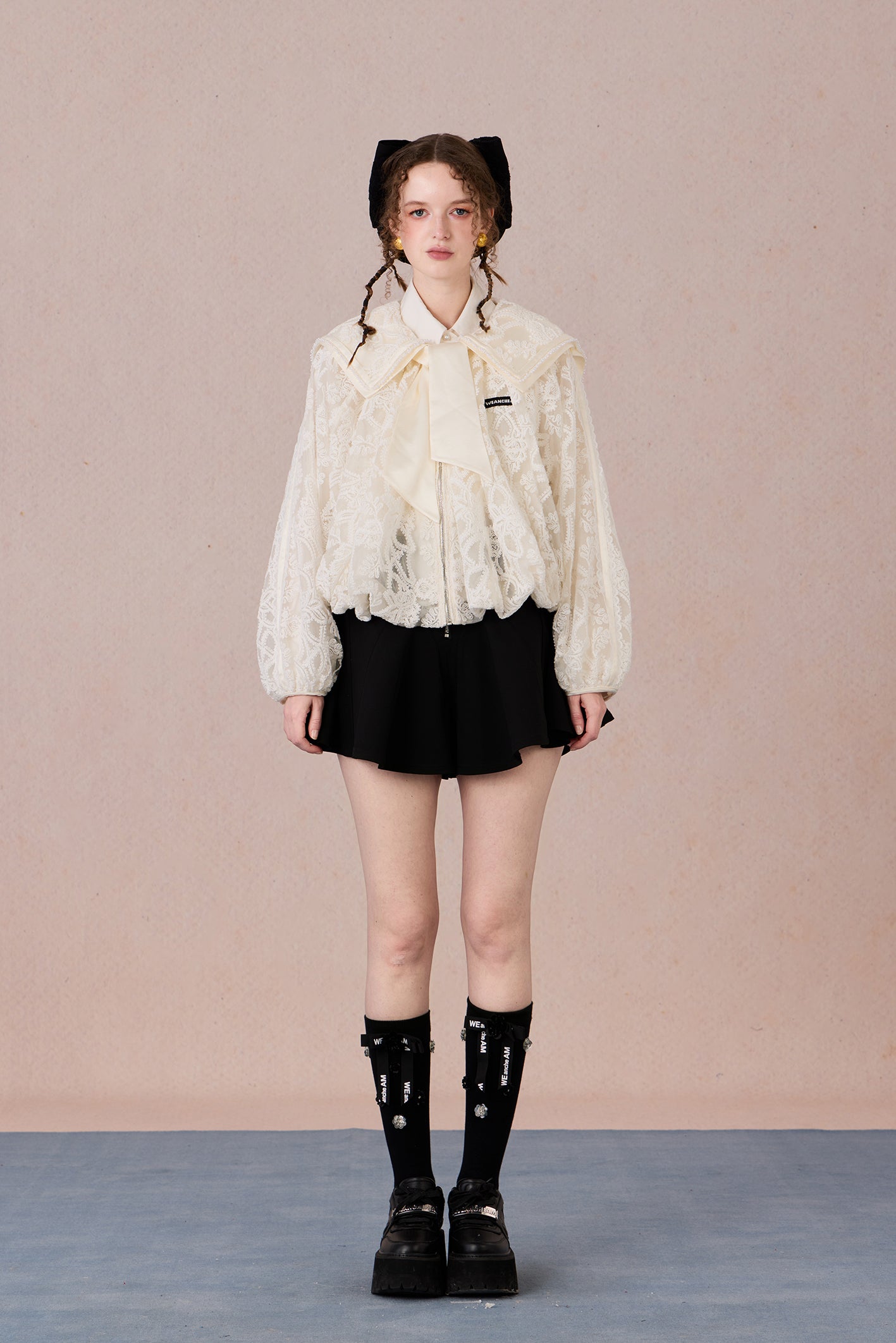 Romantic lace coat styled with skirt for spring garden look