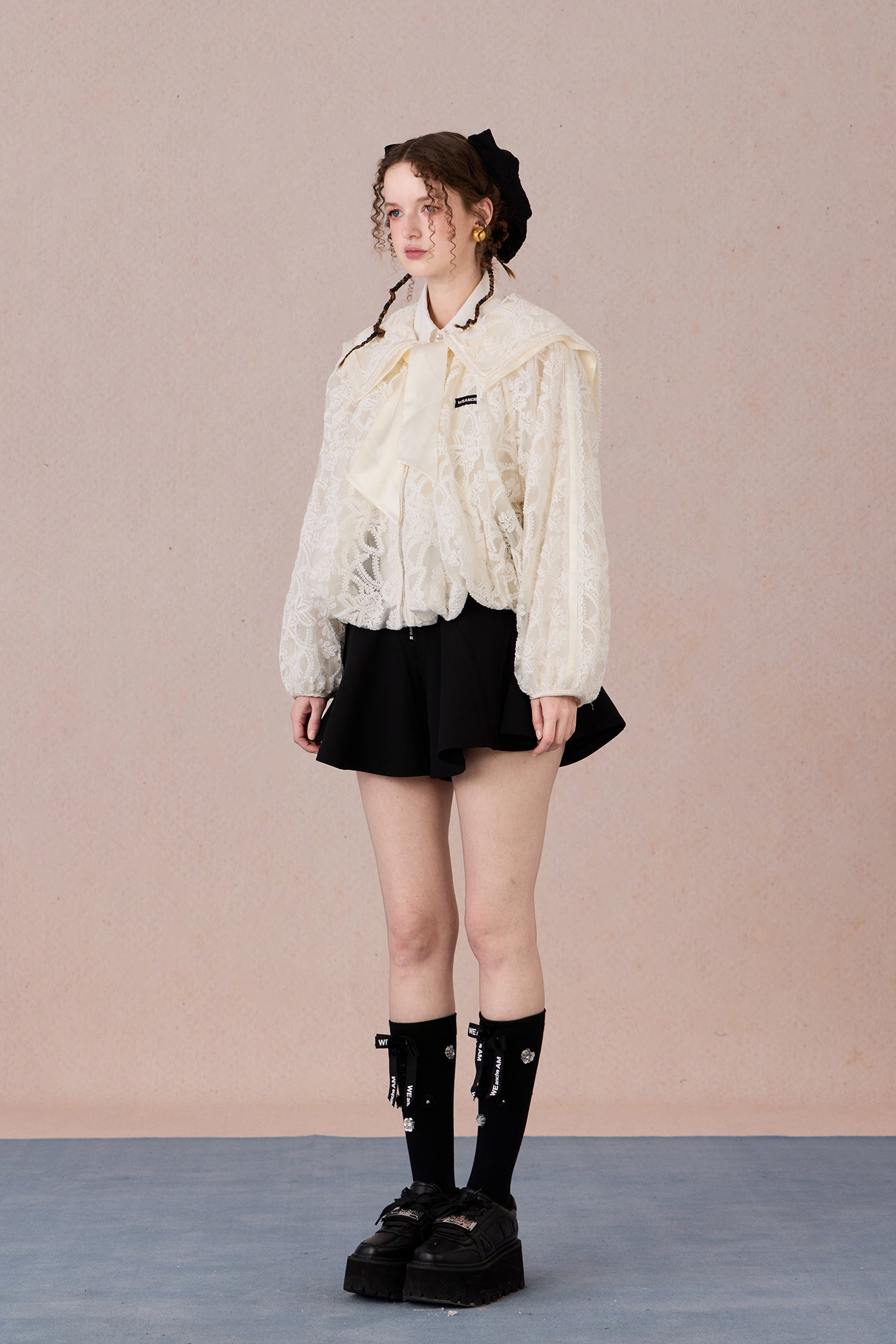 Romantic lace coat styled with skirt for spring garden look