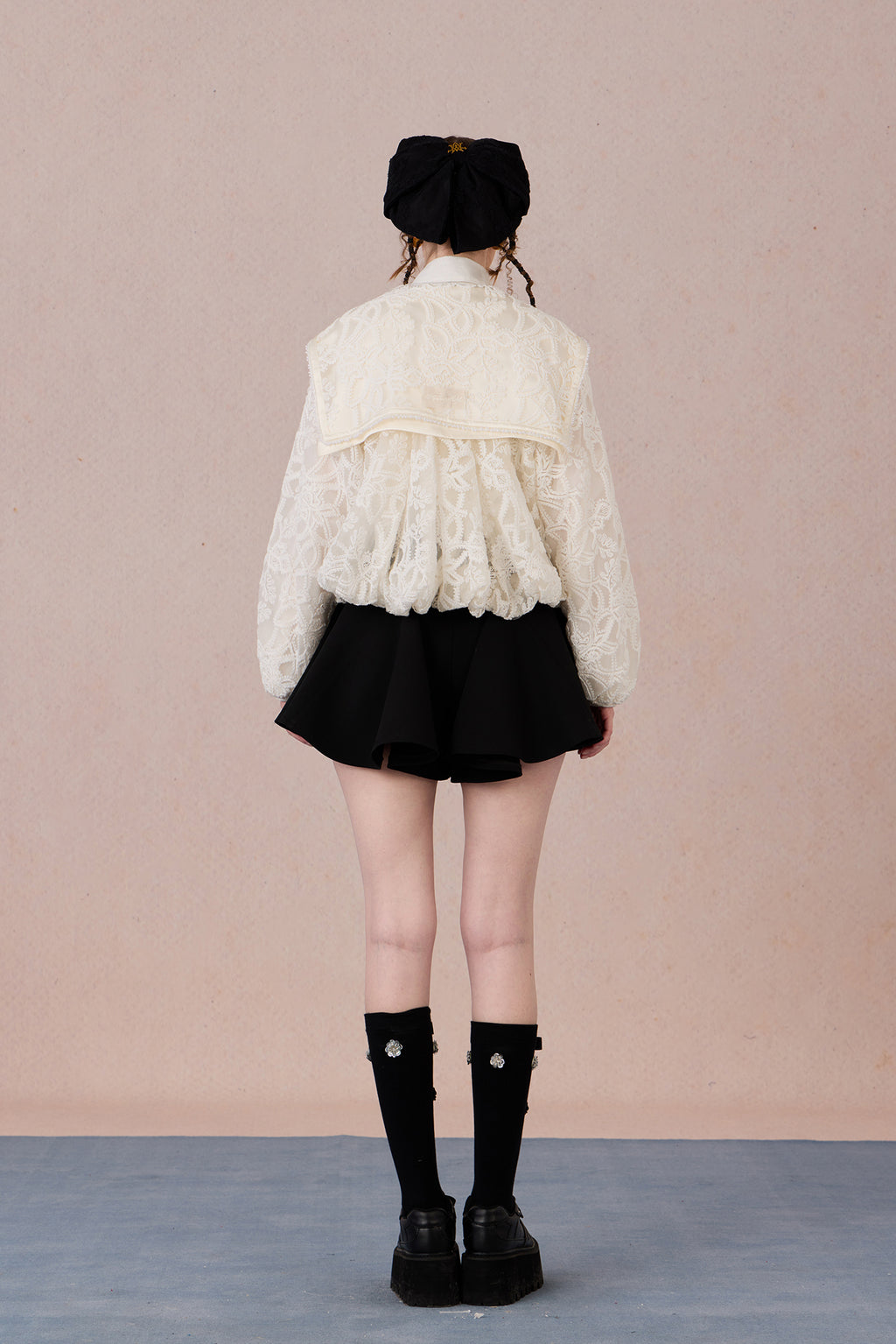 Flowing A-line hem of vintage sheer coat with soft drape