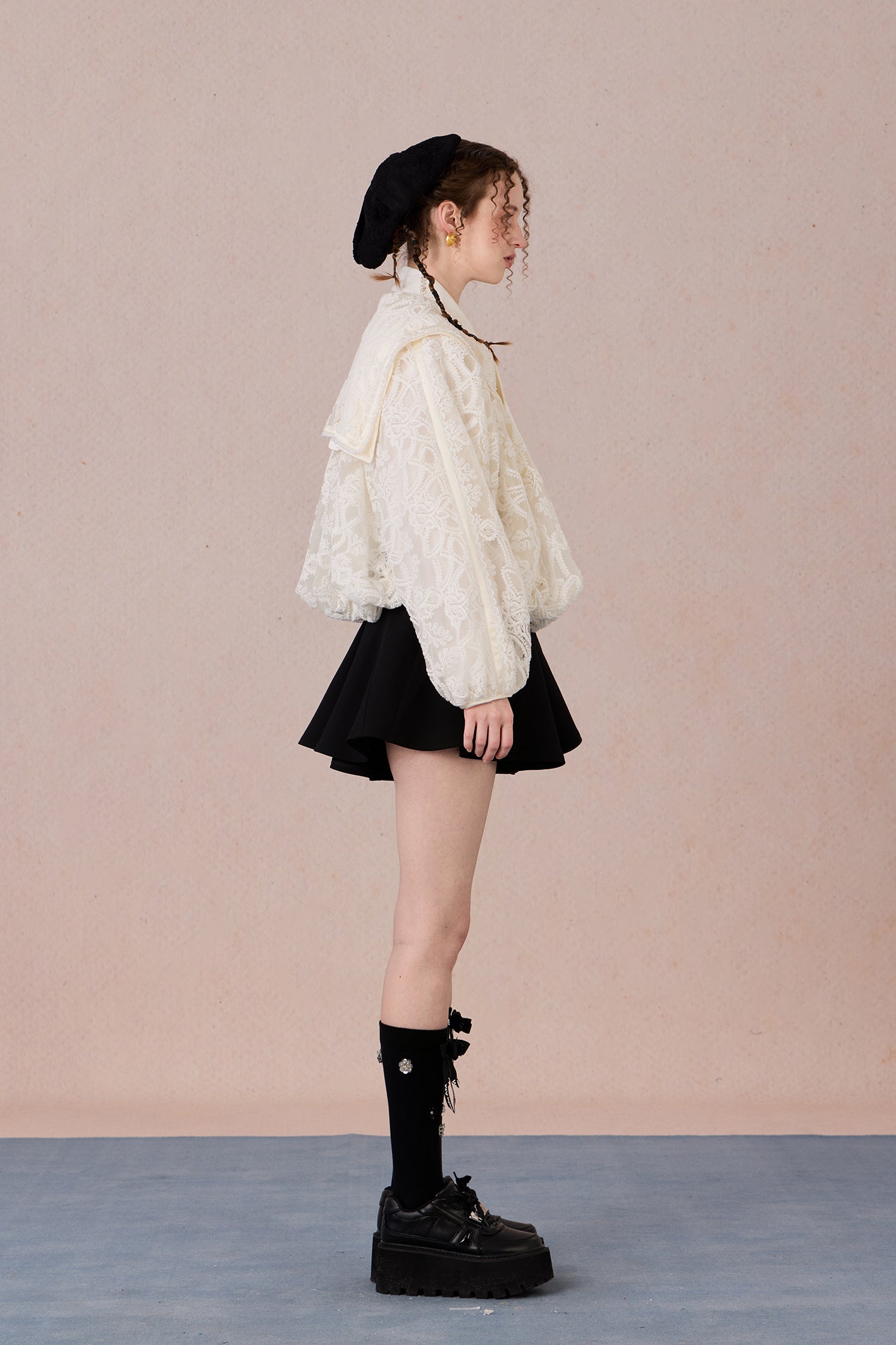 Romantic lace coat styled with skirt for spring garden look
