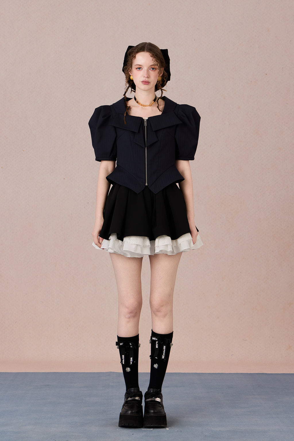 Vintage-inspired structured top with lapel collar and tailored fit
