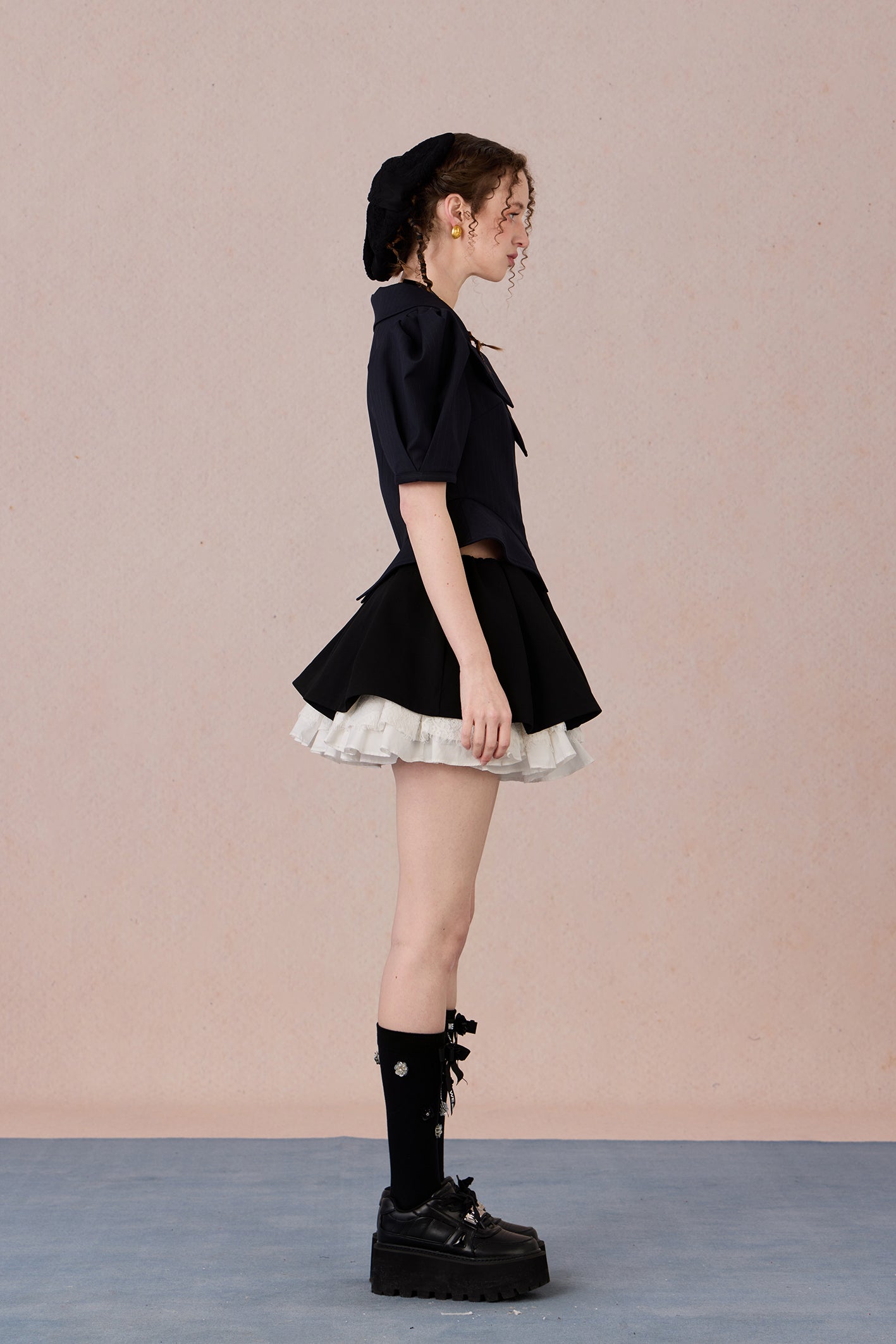 Vintage-inspired structured top with lapel collar and tailored fit