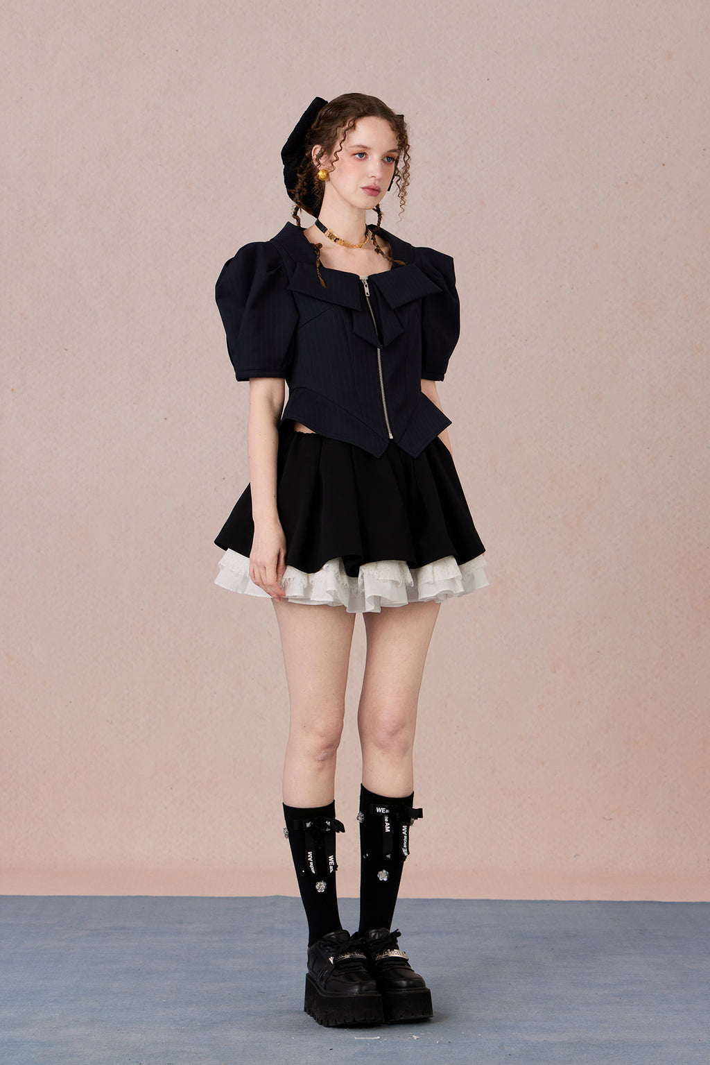 Vintage-inspired structured top with lapel collar and tailored fit
