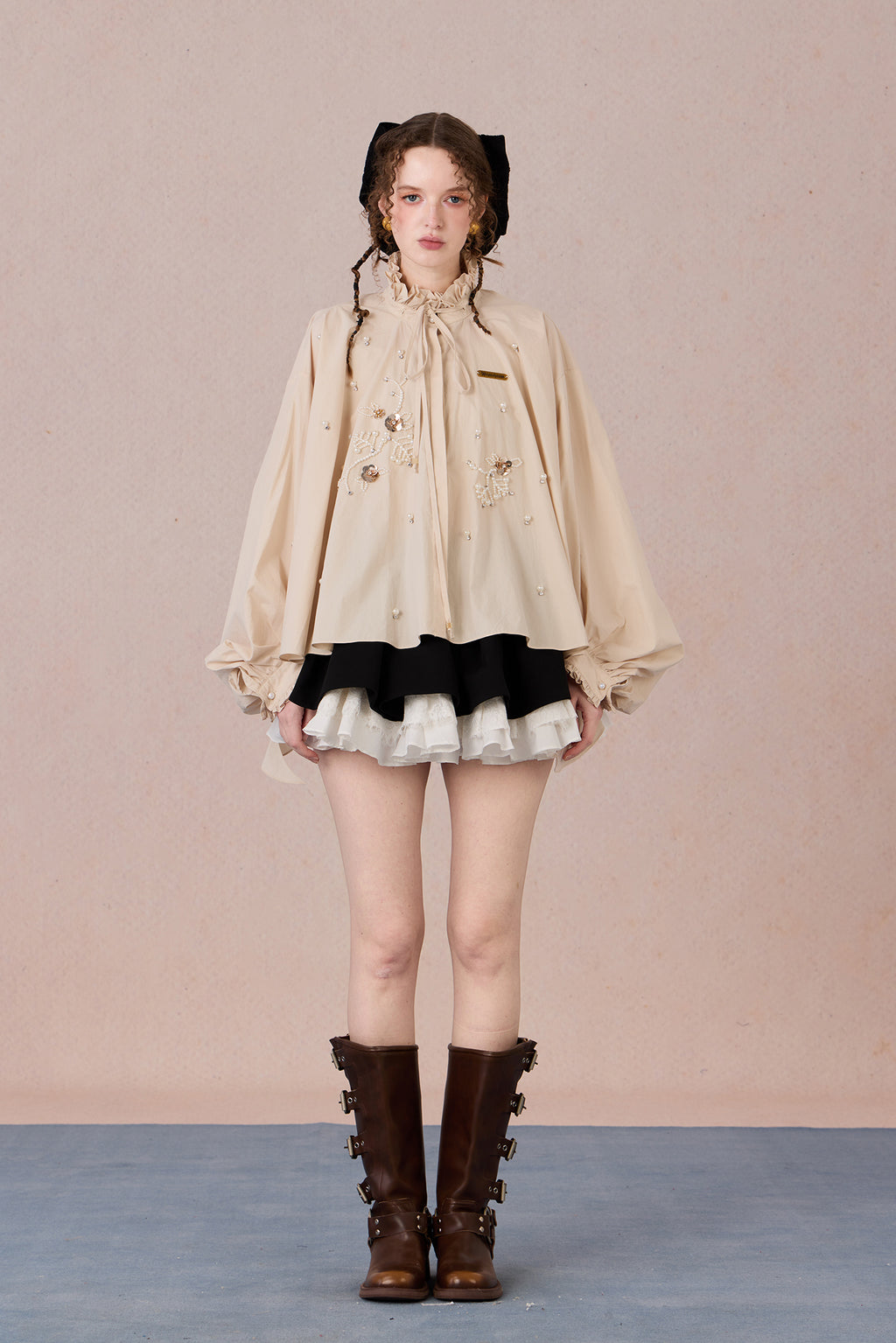 Flowing romantic shirt with beaded floral details and ruffled cuffs