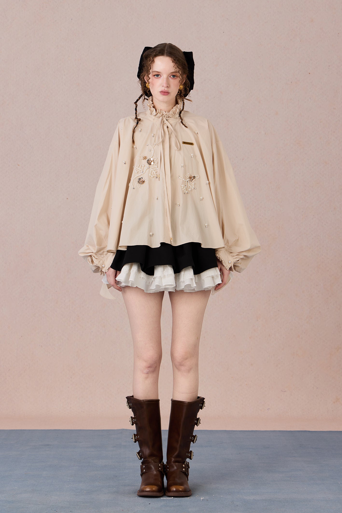 Flowing romantic shirt with beaded floral details and ruffled cuffs