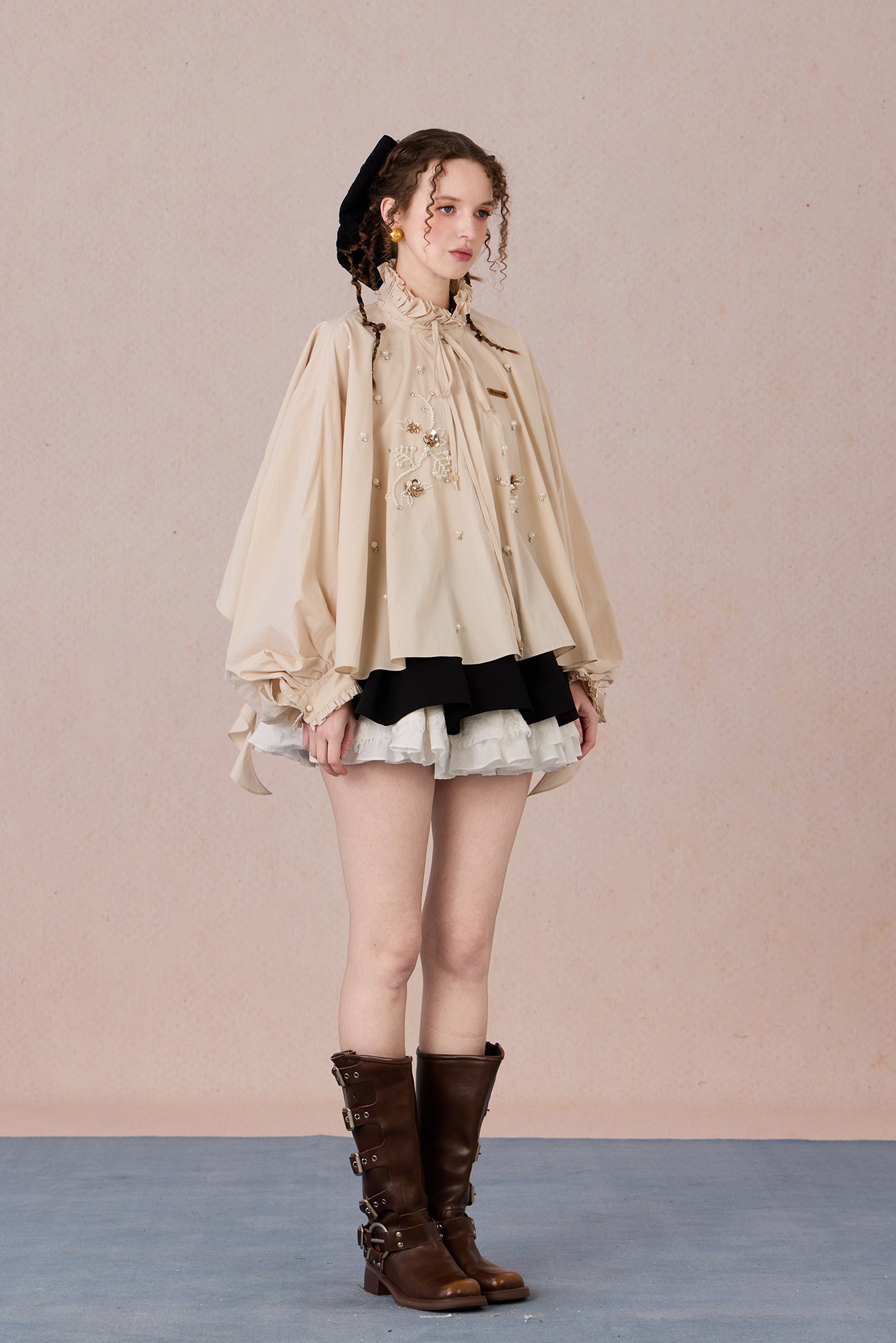 Flowing romantic shirt with beaded floral details and ruffled cuffs
